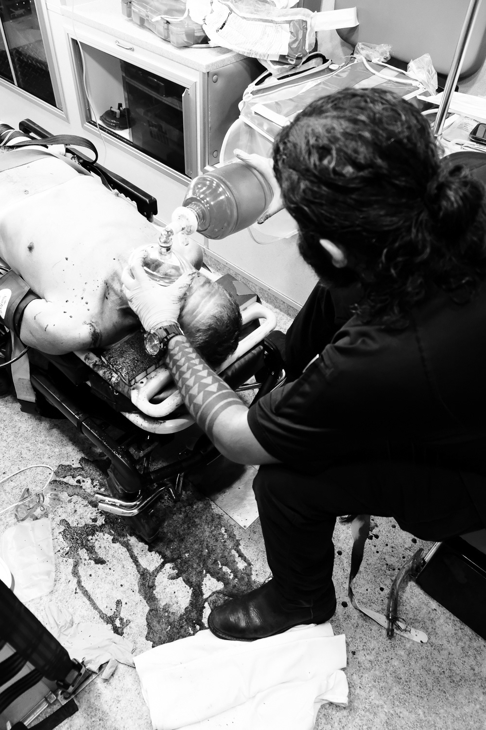 Battle for Life: The everyday life in EMS is to battle disease and death for the existence of an individual human being. Medics, fueled by duty and morality, put themselves on the front lines knowing they face the unknown. The medic pictured maintains the unresponsive patient alive until arriving at the hospital.