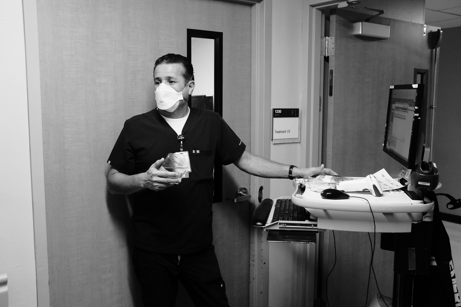 Sam, Paramedic, Firefighter and RN, prepares the antibiotic medication for his sick patient.