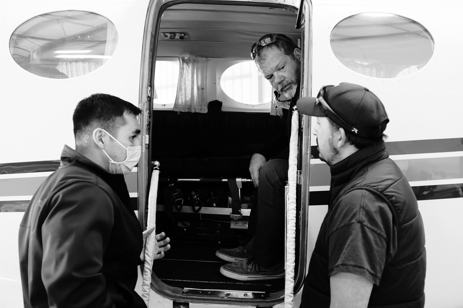 Scott,(sitting), Eddie (left) and Jesse (right) discussing the call that was just accepted for transfer to Houston, TX.