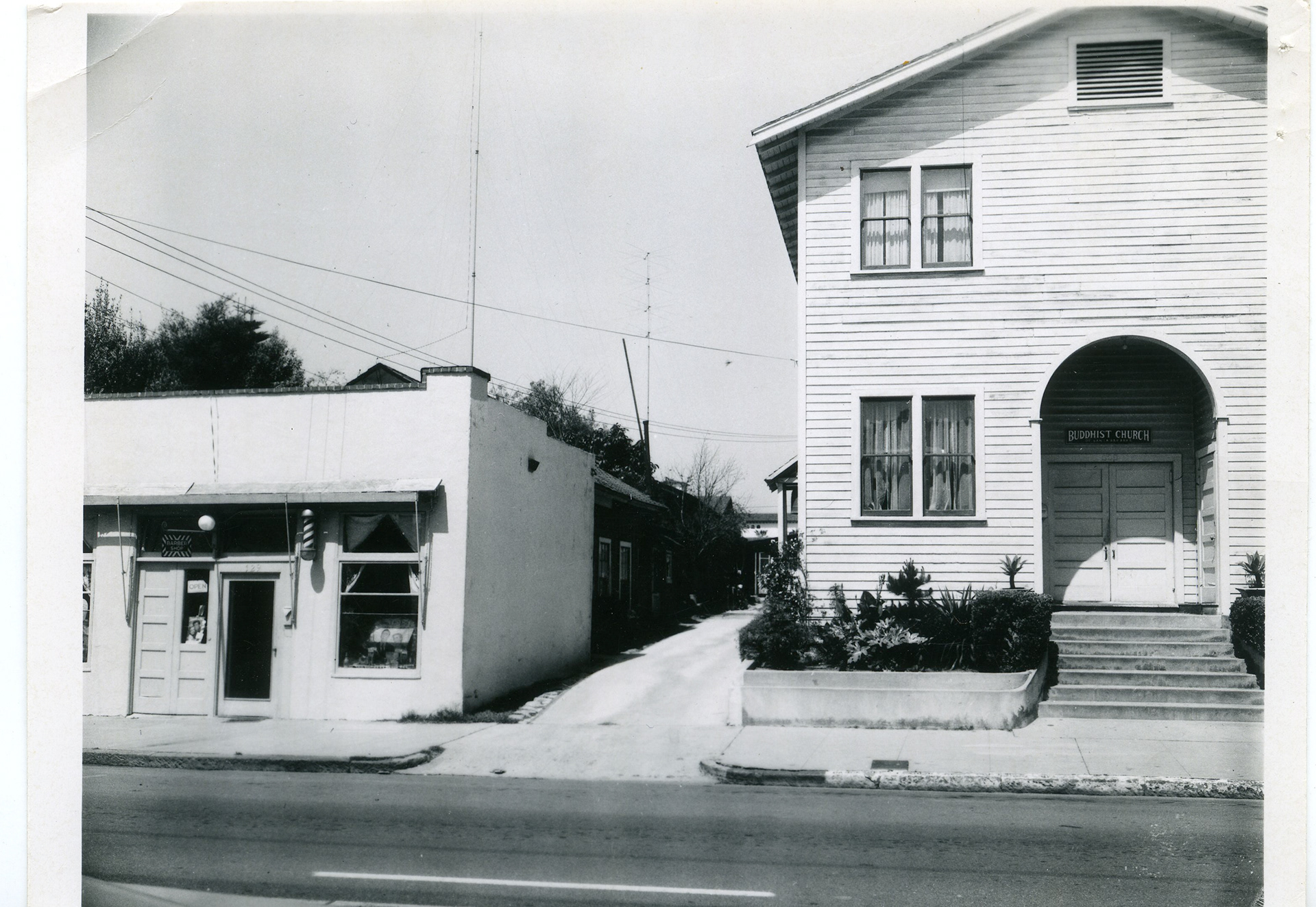 Creator Unknown. Buddhist Church and adjacent alley between church and barber shop. (prc_12378) PNC 1.1.1. Presidio Neighborhood Photograph Collection. Presidio Research Center, Santa Barbara, CA.