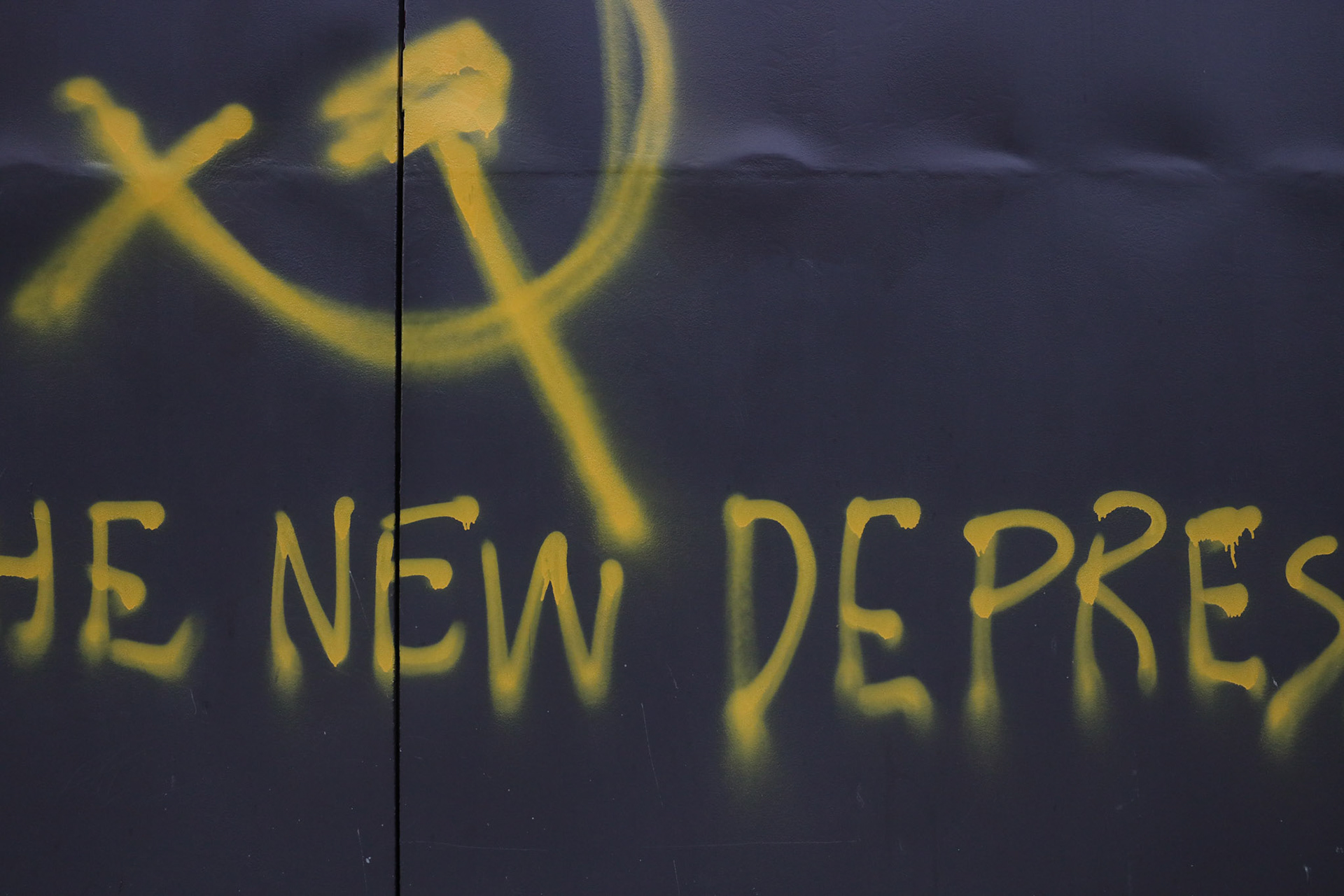 Graffiti tags began to show out on West Sixth Street at the Whiskey Fox Trot bar about the Covid-19 pandemic. The tag had a depiction of a hammer and sickle and said, "COVID-19 is a scapegoat for the new depression.