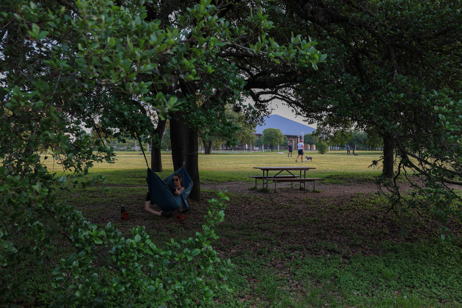 A couple lays in a hammock away from the crowds at the Town Lake Metro Park on April 20, 2020.