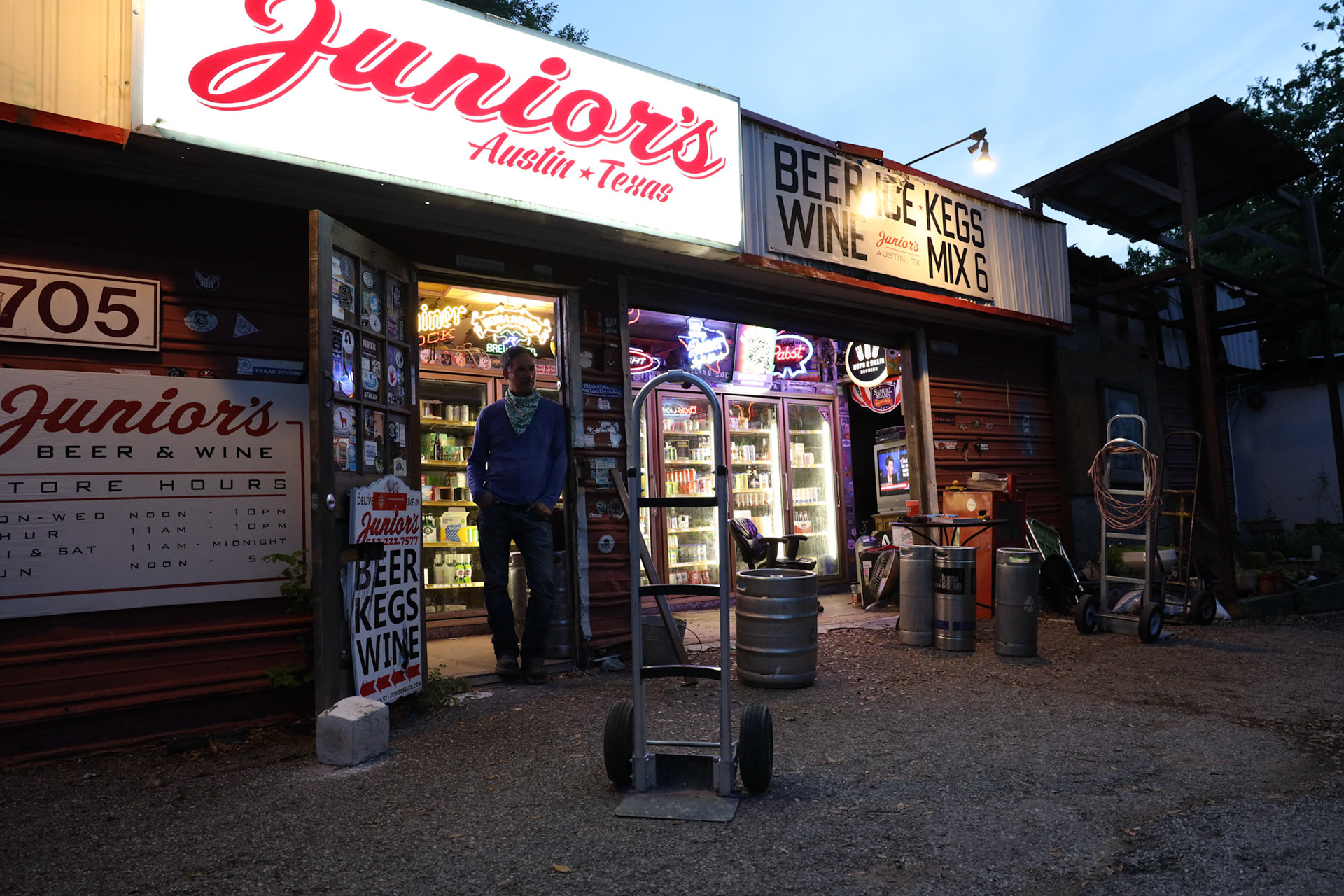 Jason Wiggins works his shift until 10 p.m. at Junior's beer shack on April 16, 2020. All liqueur and alcohol stores were considered an essential business during the city wide shutdown.