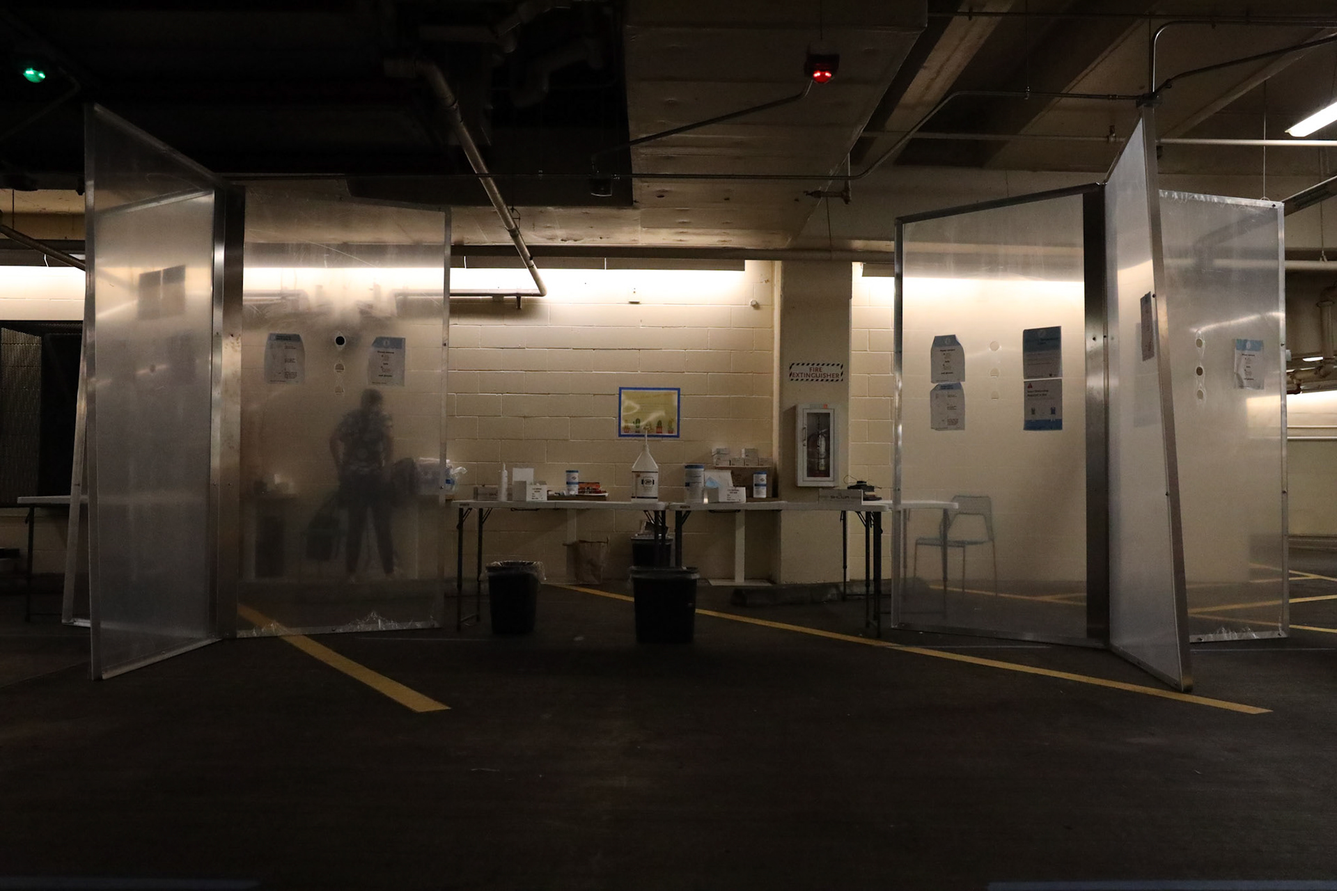 A temperature check station for Whole Foods employees at the Lamar and Fifth Street location. Whole Foods and other grocers have made it mandatory for staff to take their temperature before a shift, while also supplying staff with gloves, masks, and face shields.