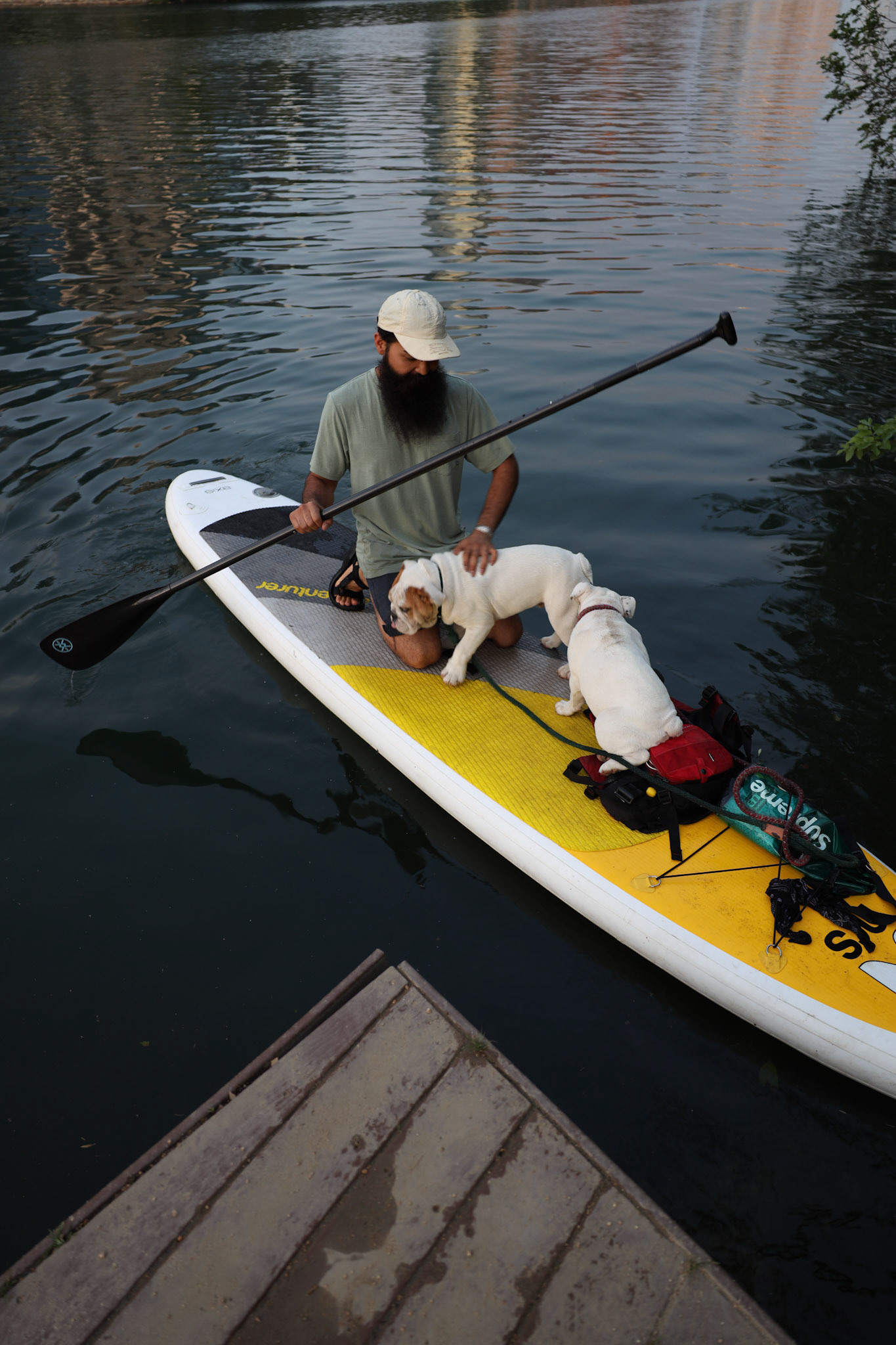 Jesse takes his young dogs, Lucy and Love, paddle boarding to get out from quarantine on April 20, 2020.