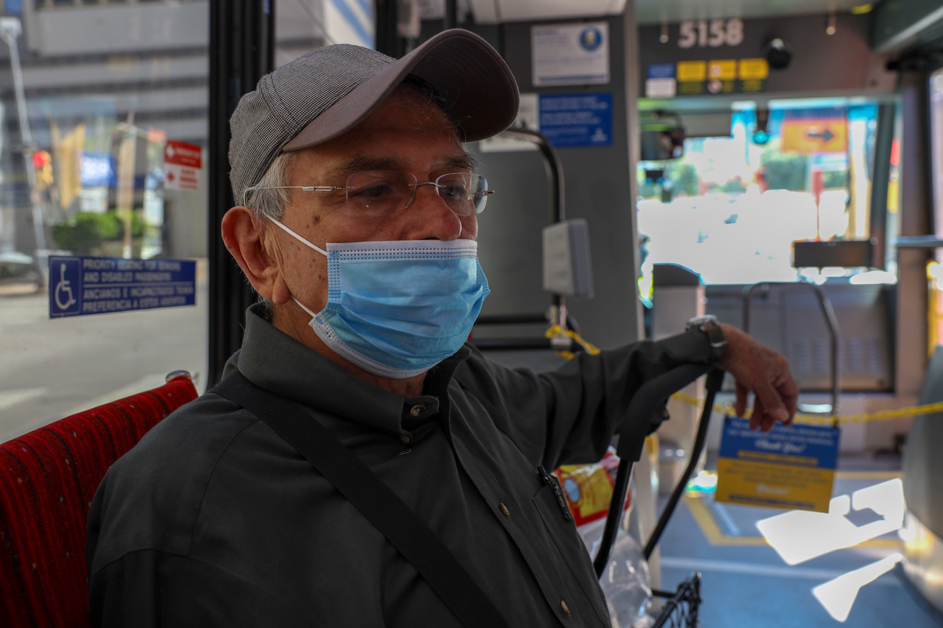 Roberto Ninares rides the Capital Metro express bus on April 14, 2020. Buffered seating arrangements, mask requirements, and the drivers section were roped off in order to keep employees and riders safe during the Coronavirus pandemic.