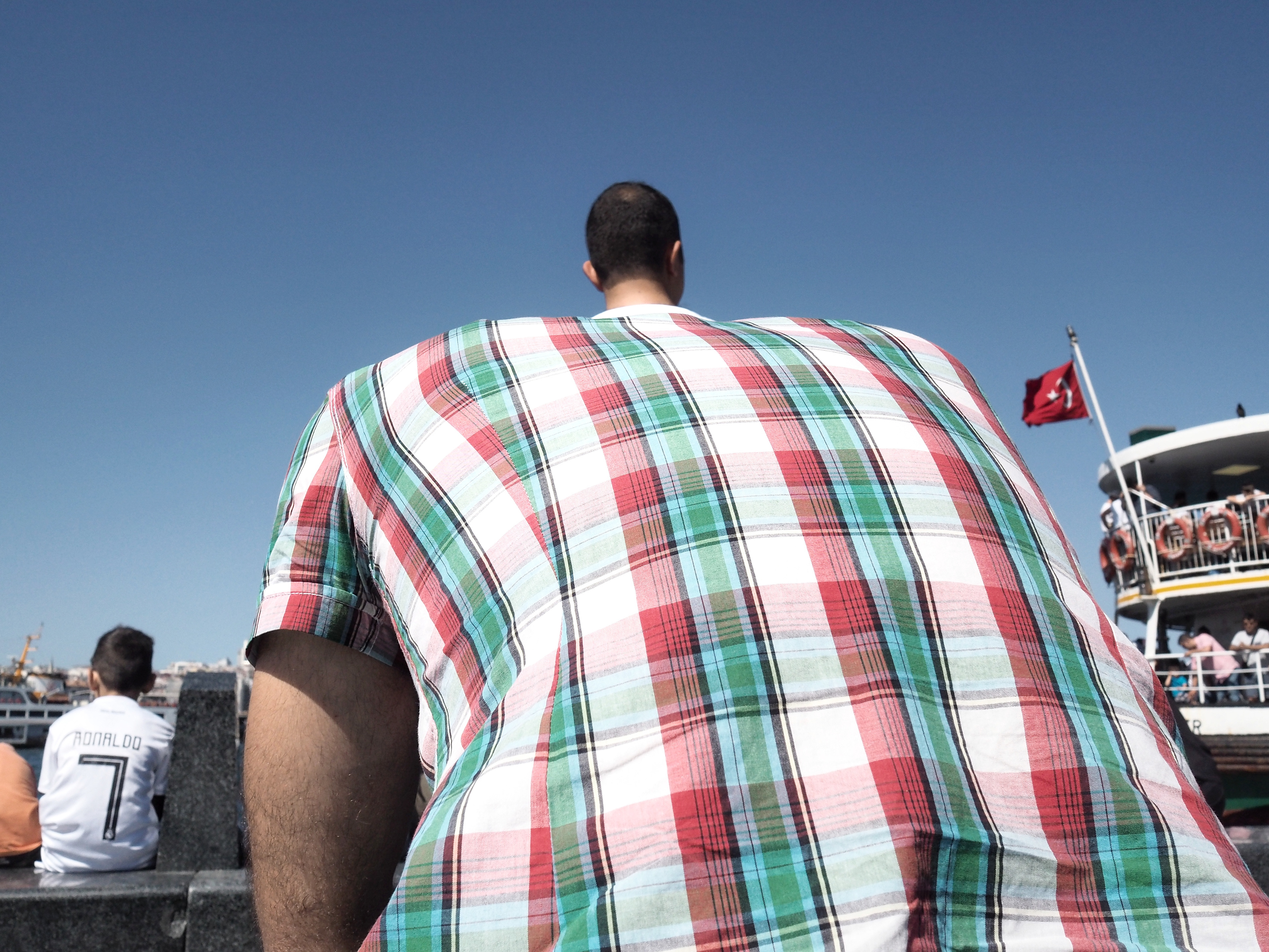 JUXTANBUL CANDID - Taken in Eminonu/Istanbul - head - ferry - juxtaposition