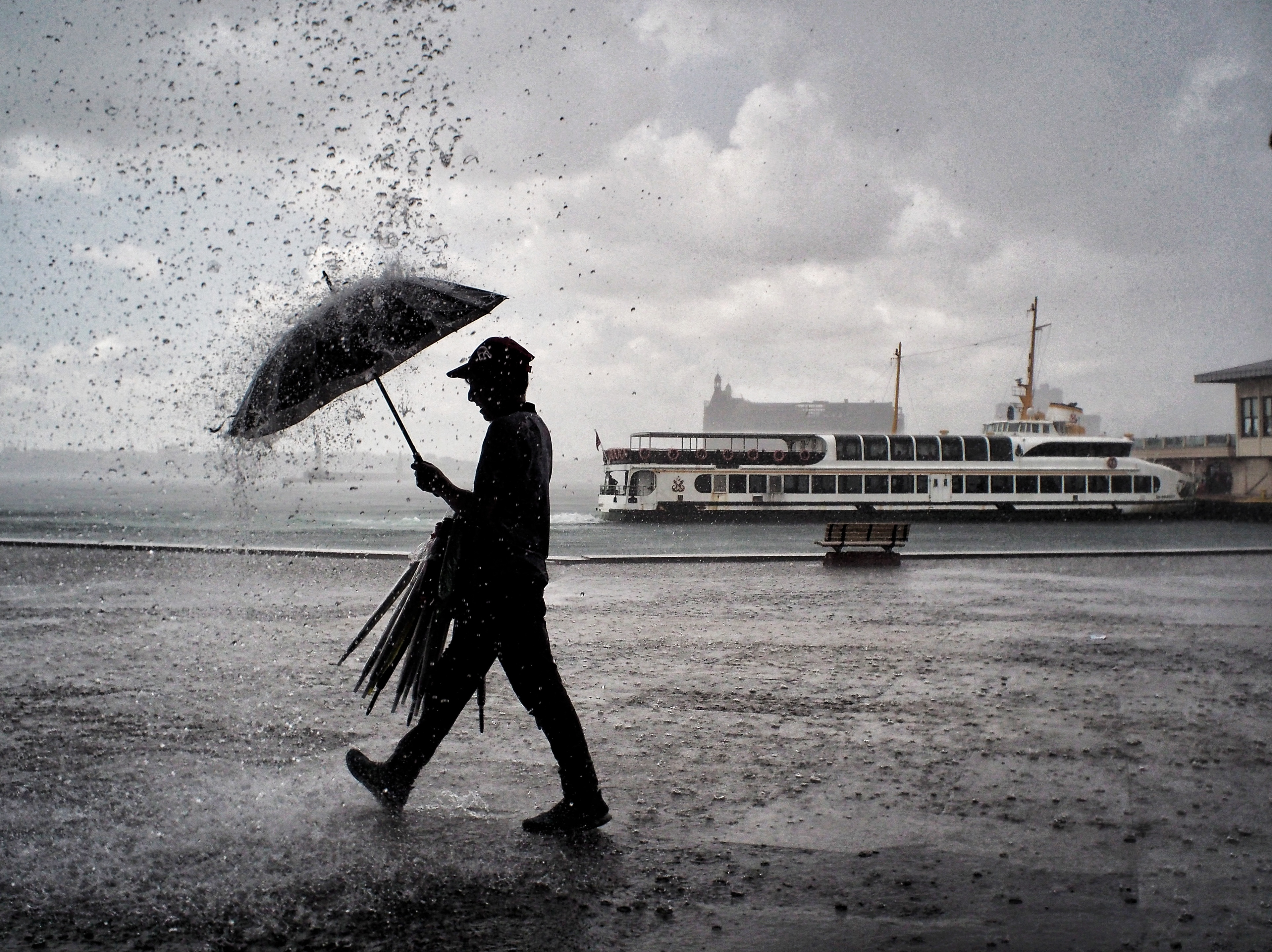 JUXTANBUL CANDID - Taken in Kadikoy/Istanbul- ferry - Haydarpasa - rain - umbrella - juxtaposition