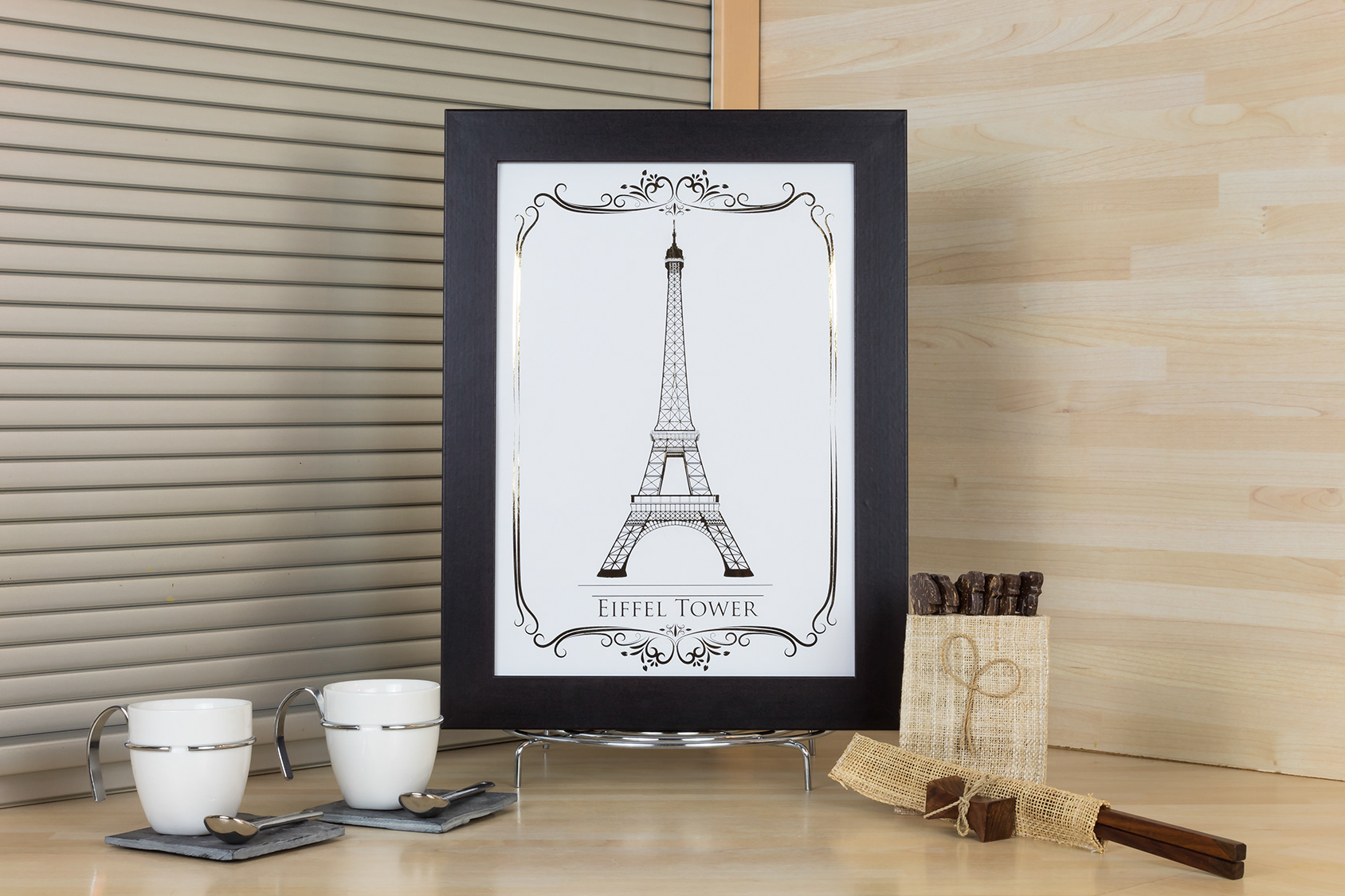 Print of the Eiffel Tower monument, with gold foil and a black frame.