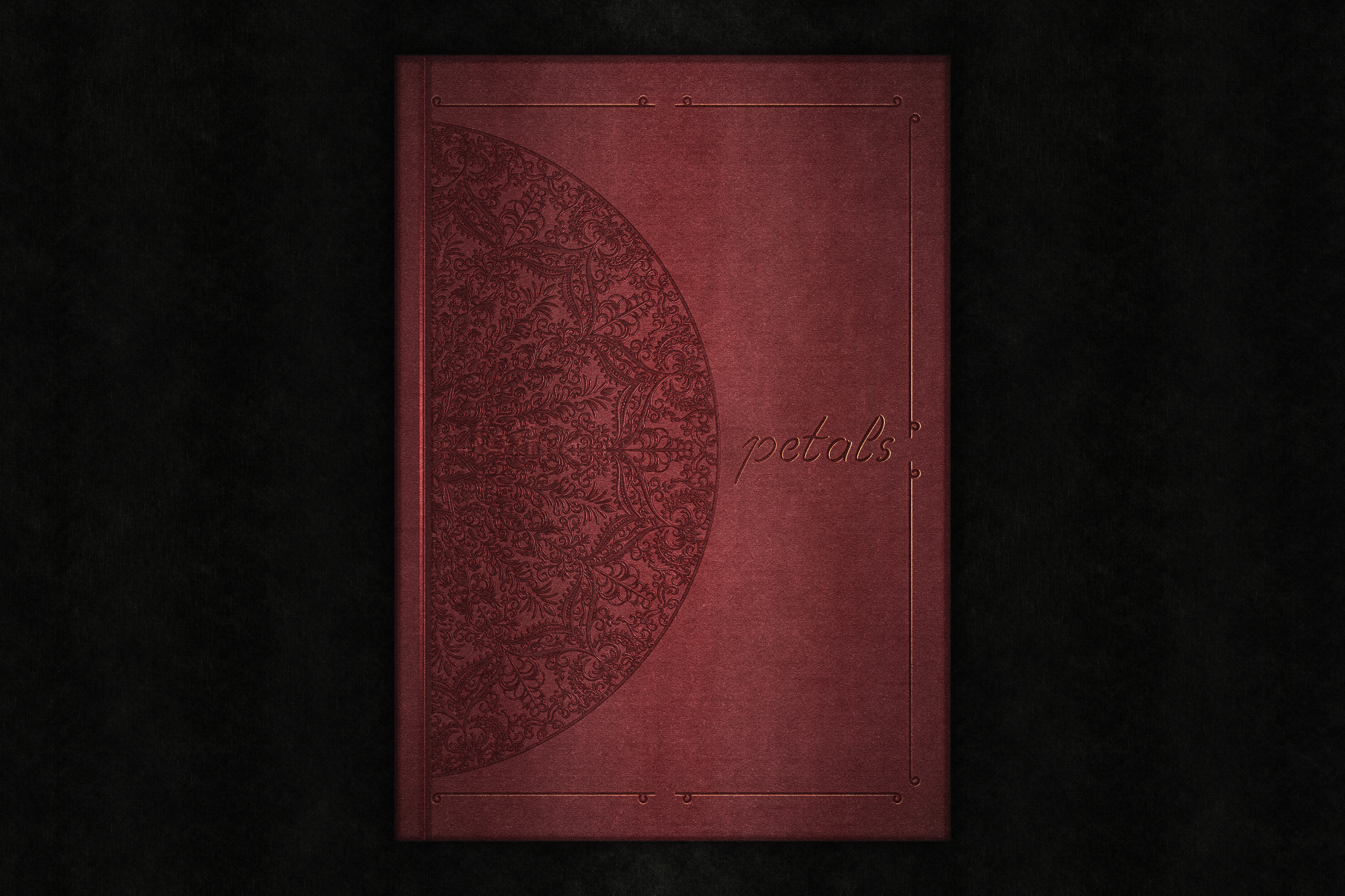 Digital red book cover with blind debossed mandala and a background mockup.