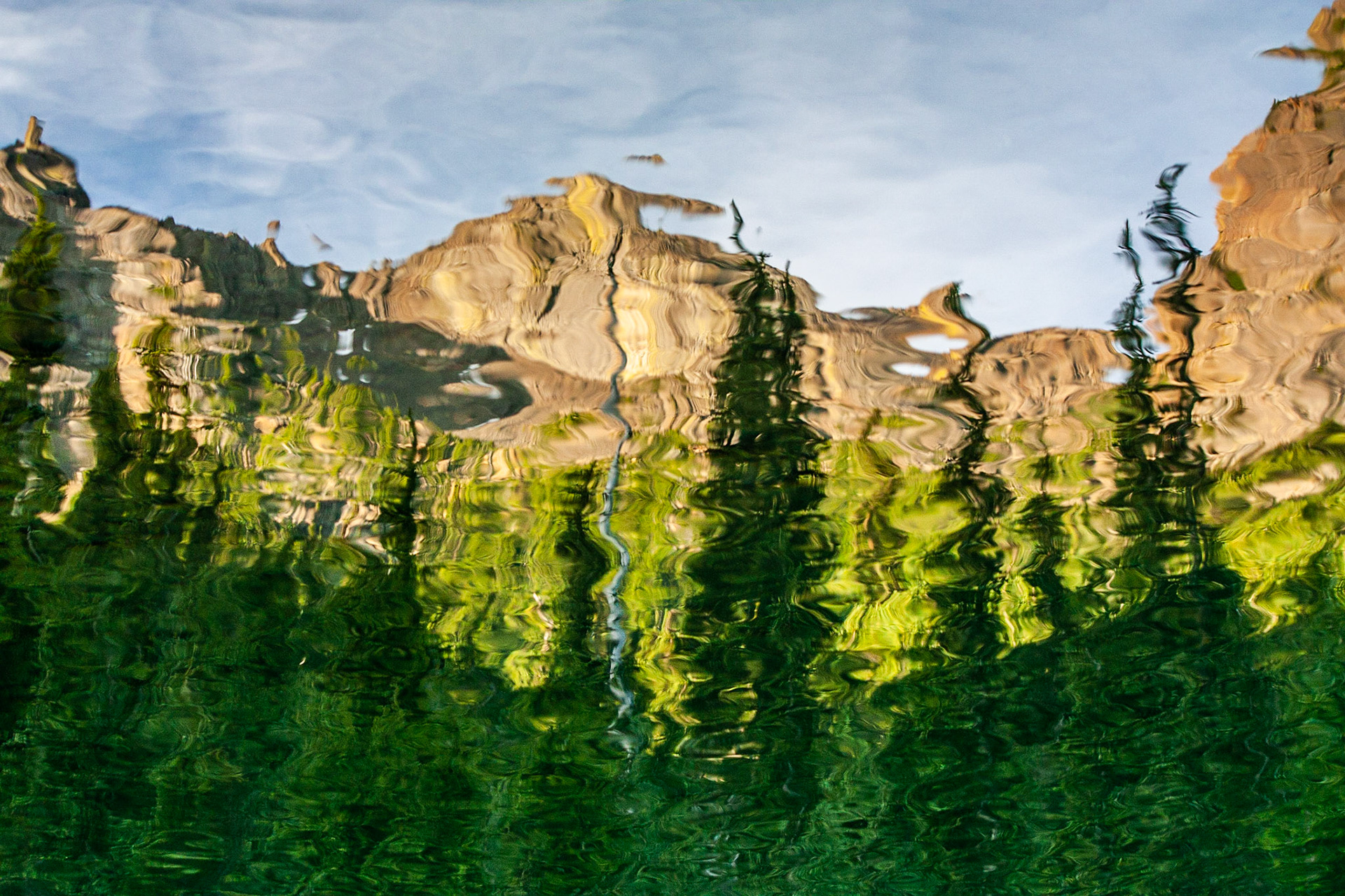 The reflections of Buckhorn Lake around Marmot Pass