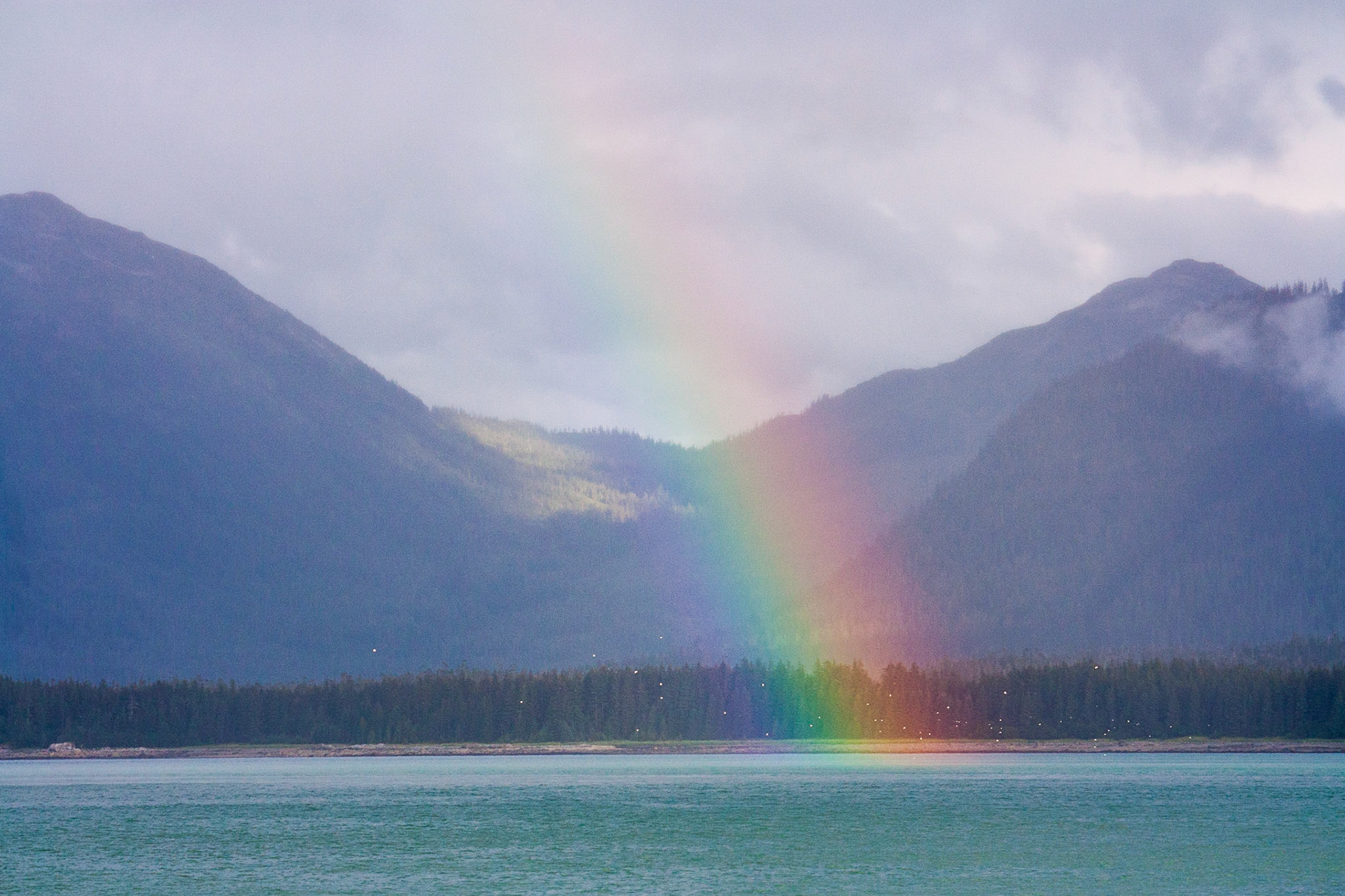 A rainbow appears off the coast of Baranoff Island in Southeast Alaska, USA.