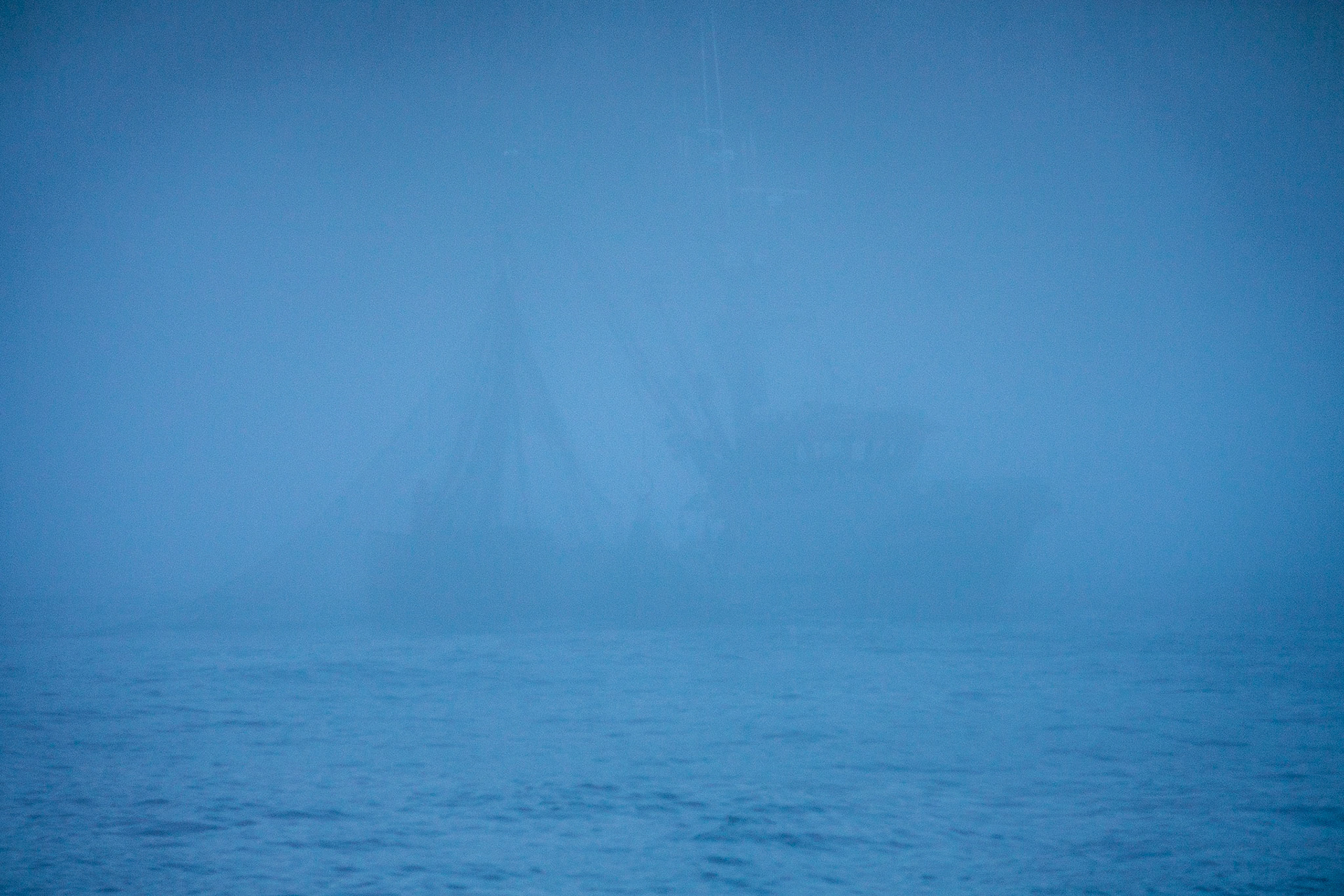 A seiner works in the fog off the coast of Baranoff Island in Southeast Alaska, USA.