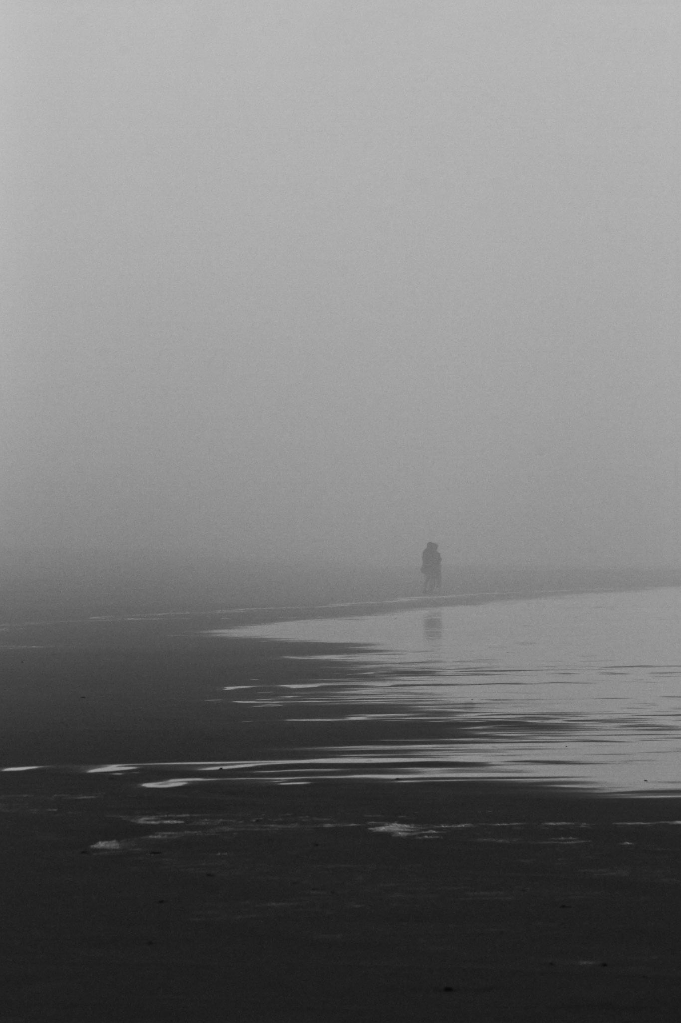 A man disappears into the mist.