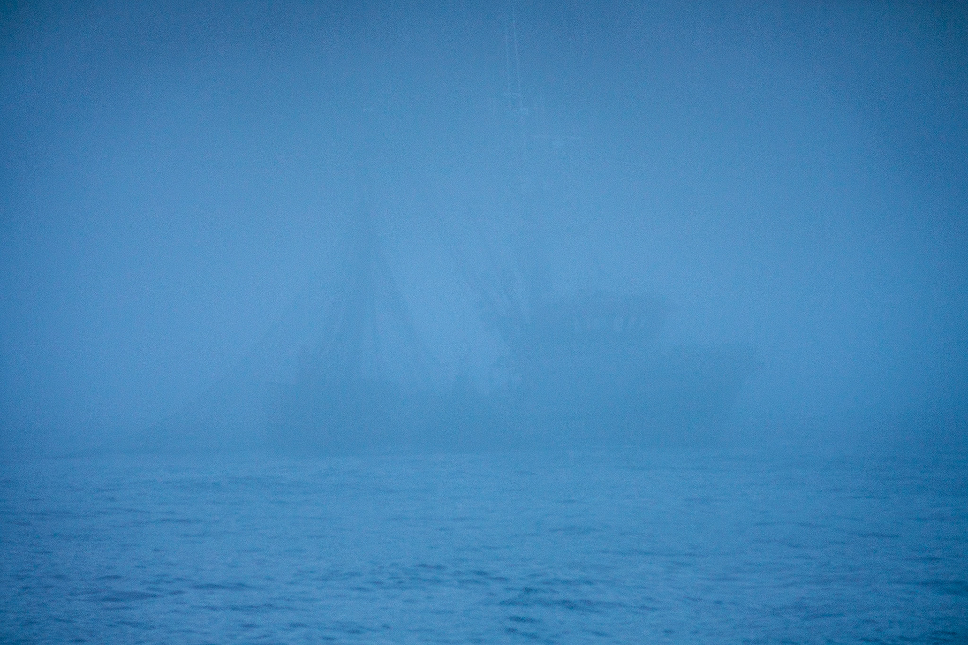 A seiner works in the fog off the coast of Baranoff Island in Southeast Alaska, USA.