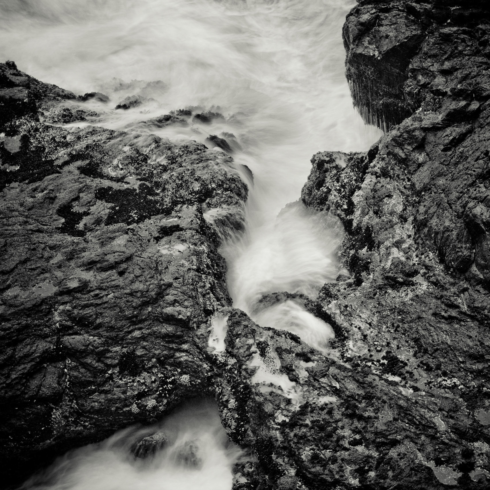 The tide starts to descend on the coast of Trinidad, CA.
