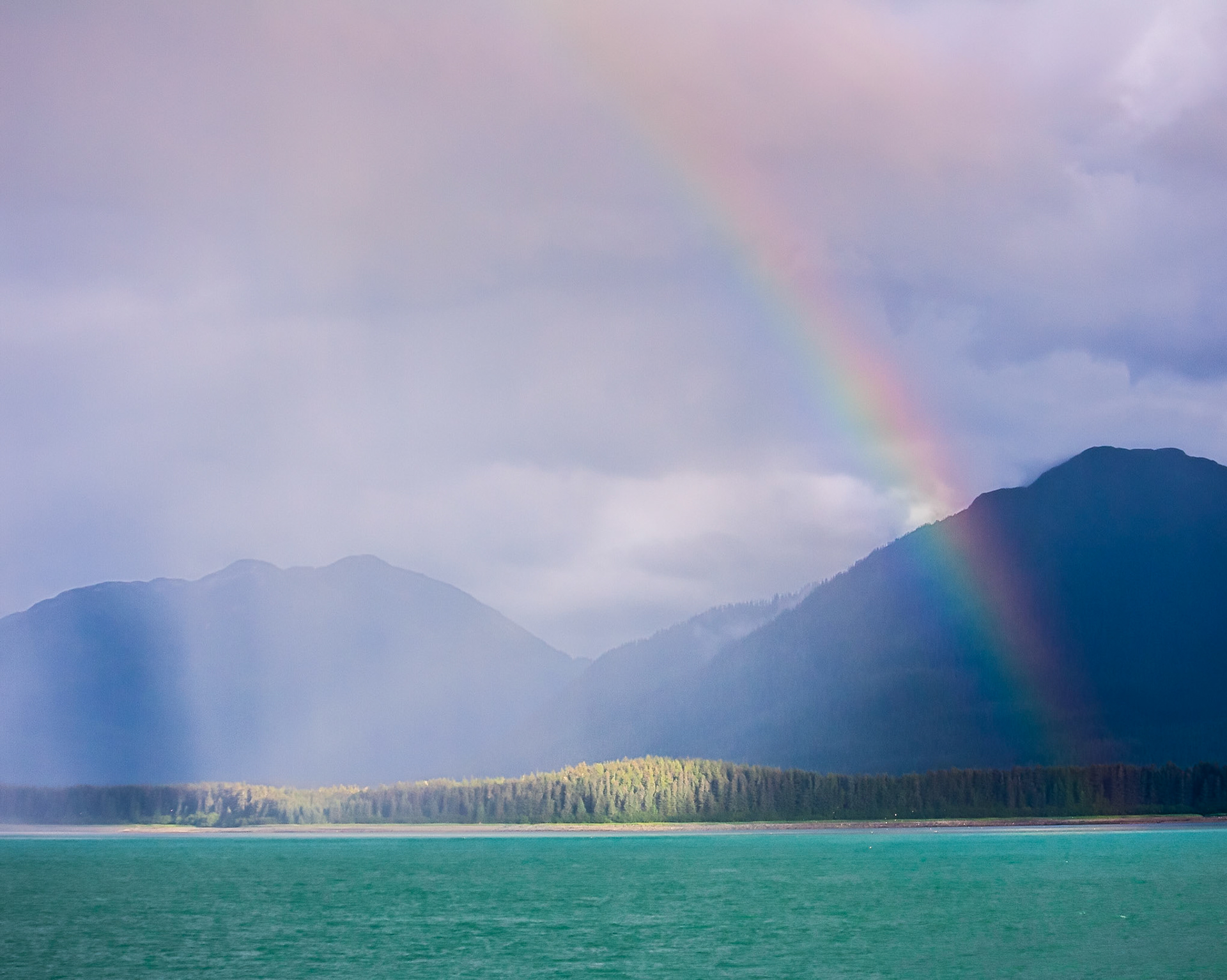 A rainbow appears off the coast of Baranoff Island in Southeast Alaska, USA.