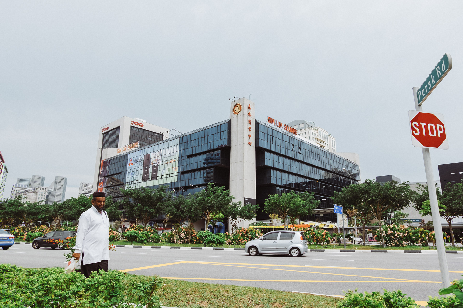 Street photography of a building in Singapore and people
