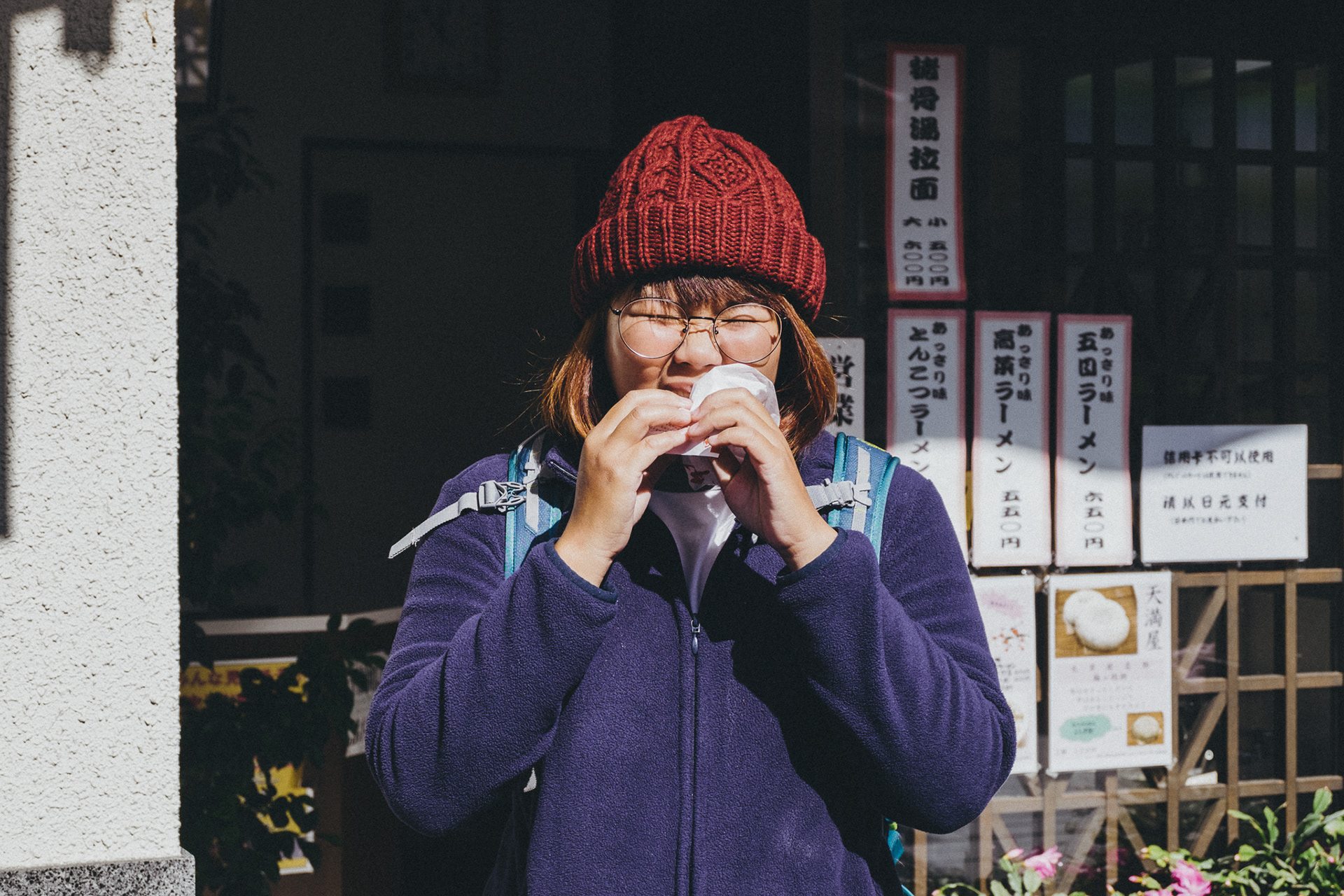 My female friend is eating taiyaki.
