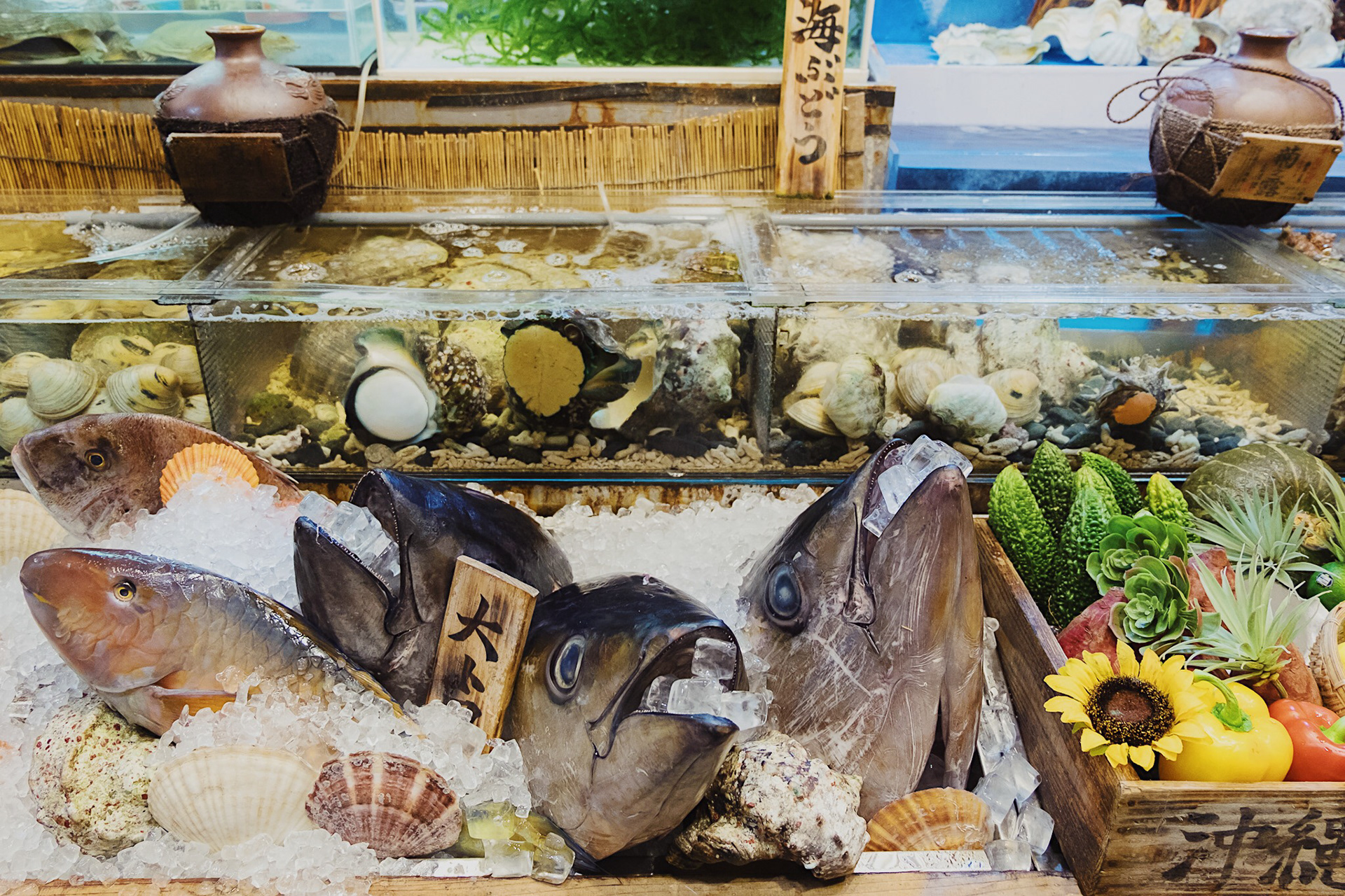 A seafood shop that displays seafood in front of the store.