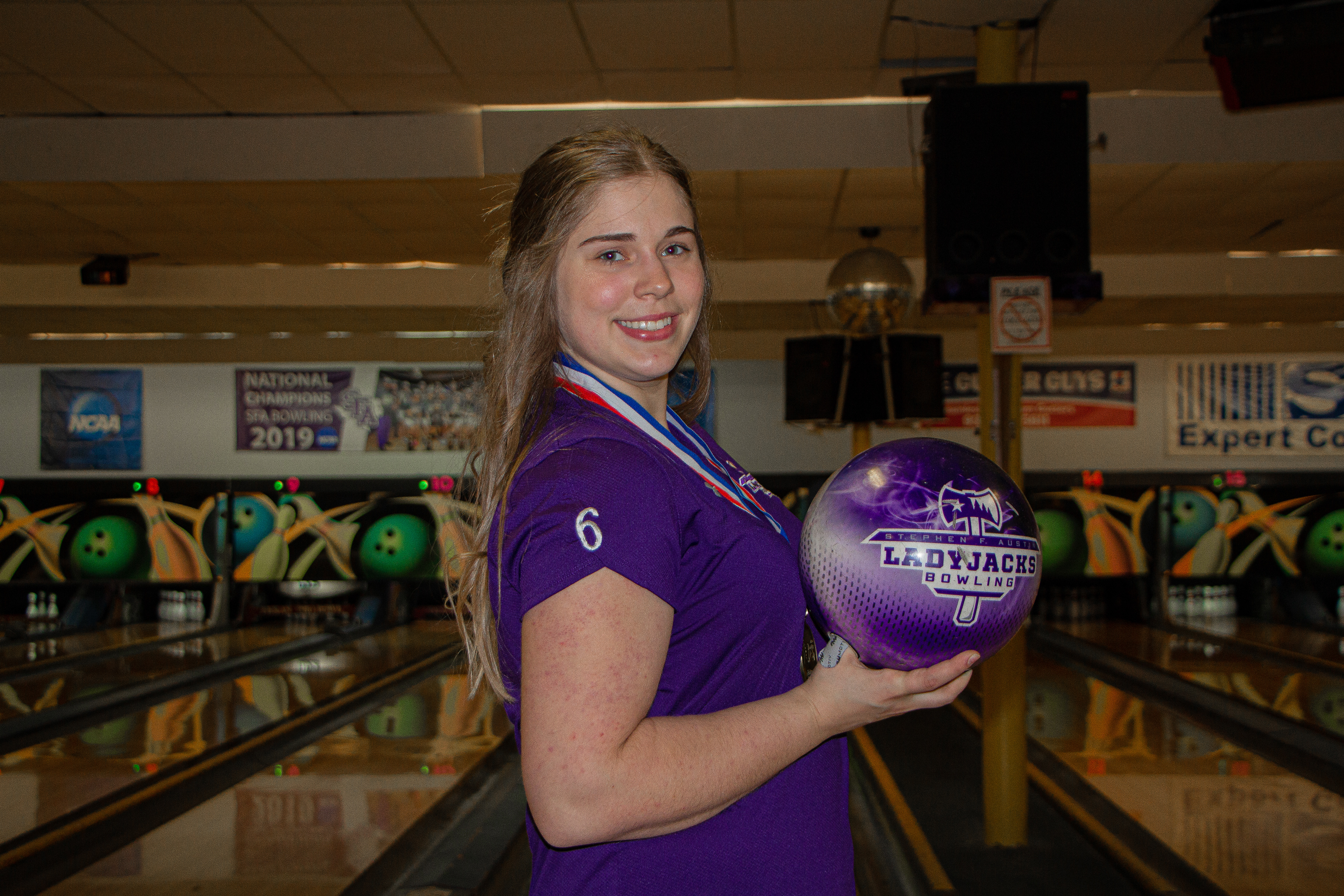 Chloe Skurzynksi, a junior Psychology major from Carlisle, PA., sits with her bowling ball in her lap. She won her spot on the adult Team USA when she won the U.S. National Amateur Bowling Championship title in January.