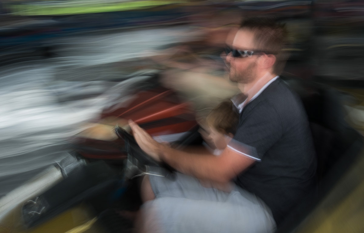Man with child on the dodgem cars at Clareville A&P Show, Carterton, 2017