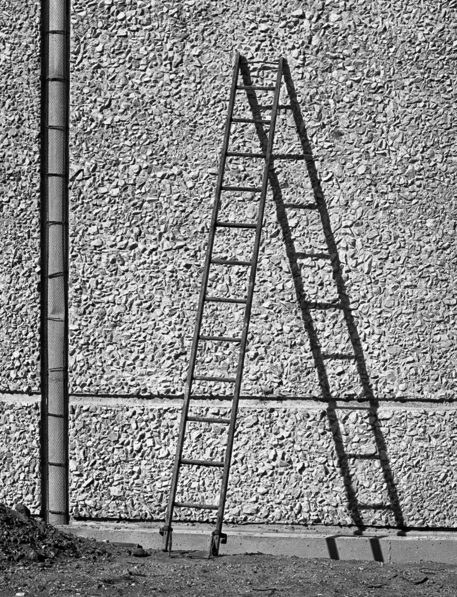 Ladder and shadow against wall of Invercargill water reservoir, Down Street