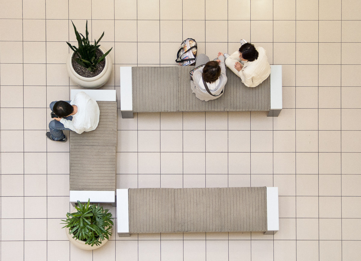 Shoppers seated on benches in a shopping mall at Burnaby, South Vancouver, 2011