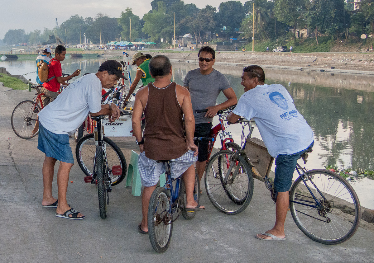 Cyclists chatting beside the Marikina River, 2013