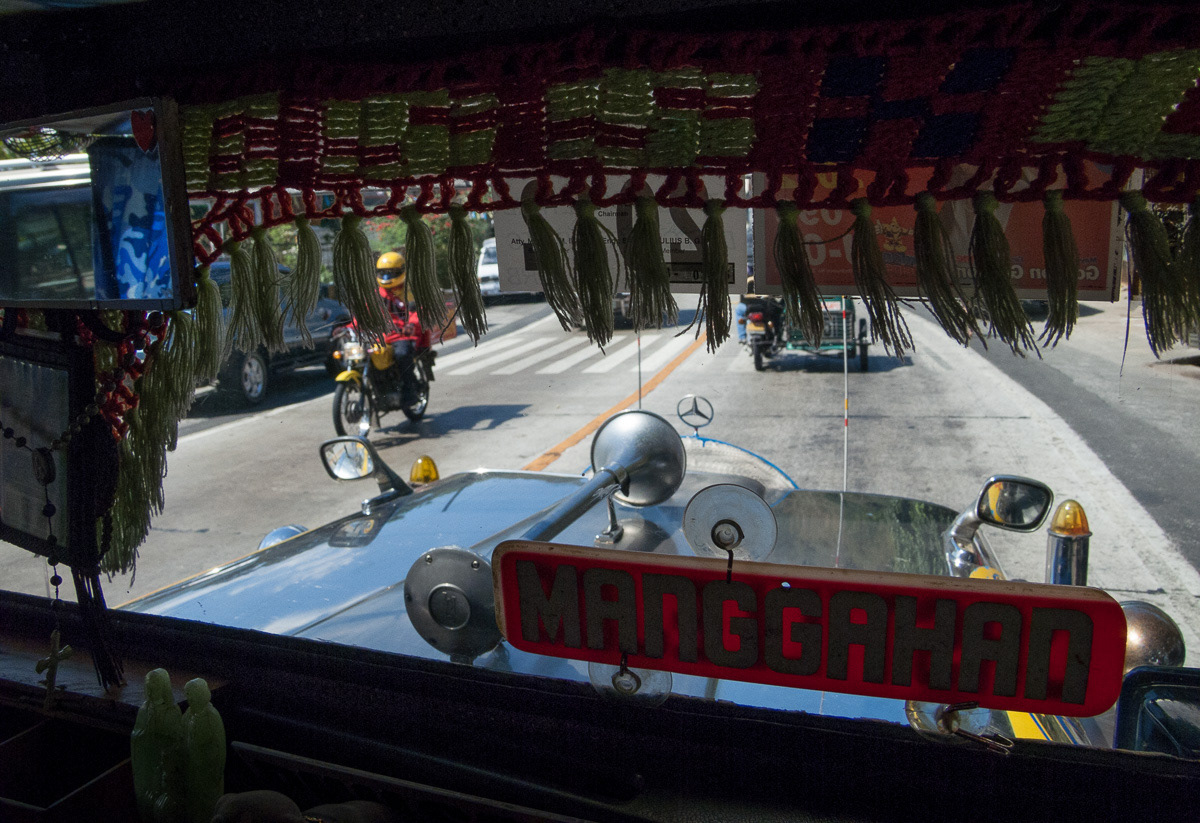 Looking through front window of a decorated jeepney, Olongapo, Philippines, 2013