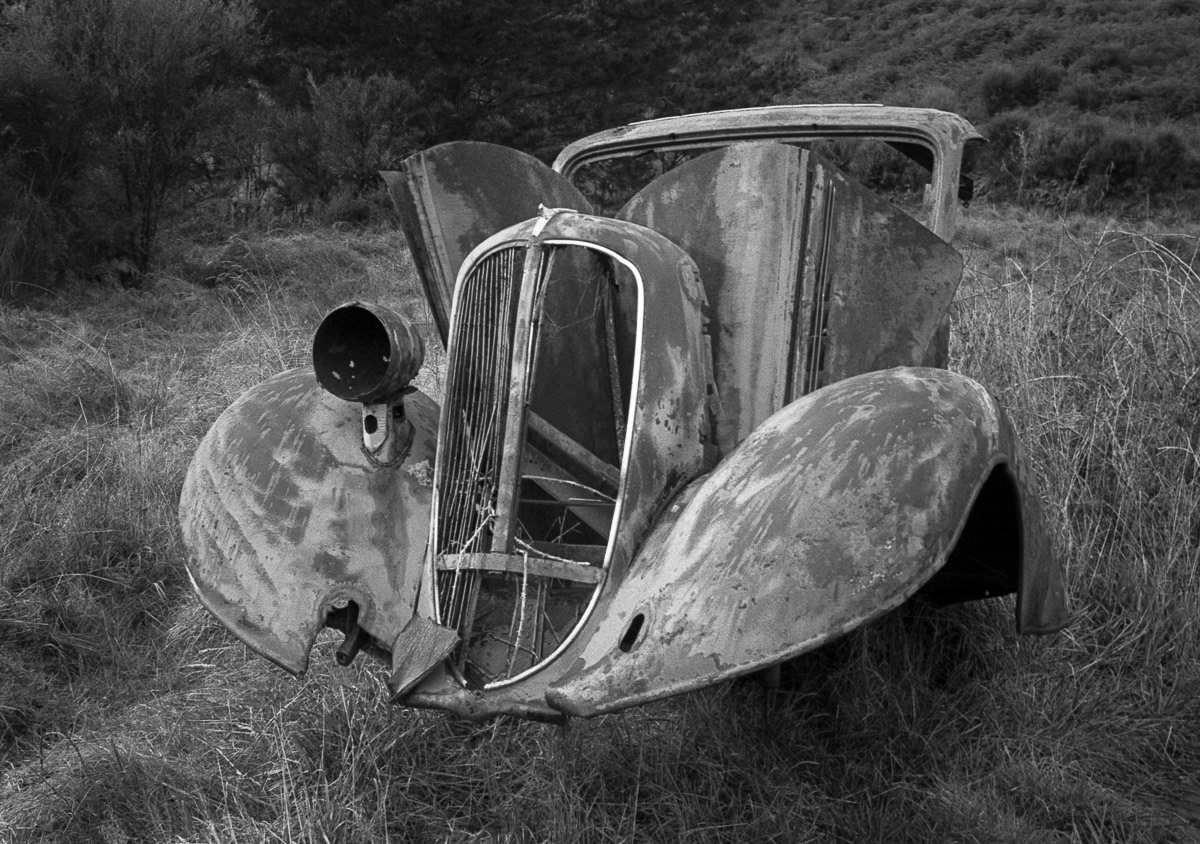 Remains of an old car near the Wanganui River south of Taumarunui, 1985
