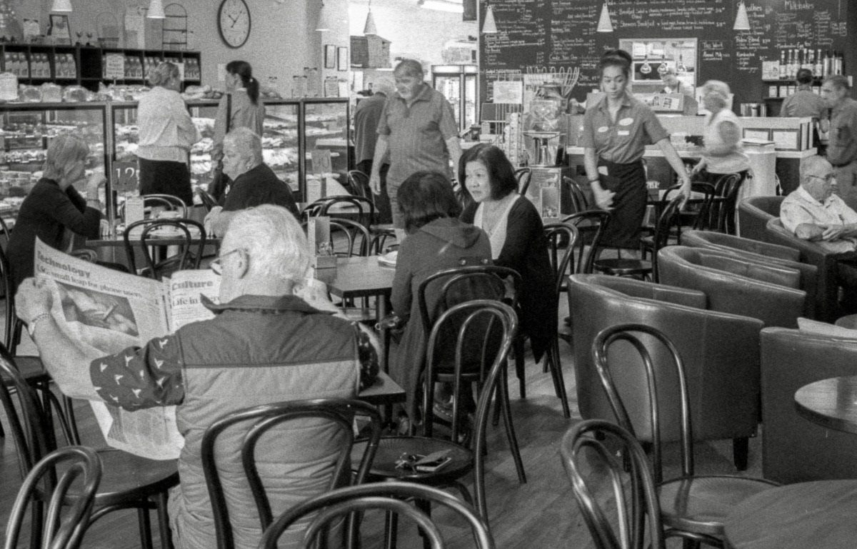 Customers at tables in Ten O'clock Cookie cafe, Masterton, 2016
