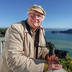 Dave Wood with camera at Waikato Heads, photo by Mel Wood