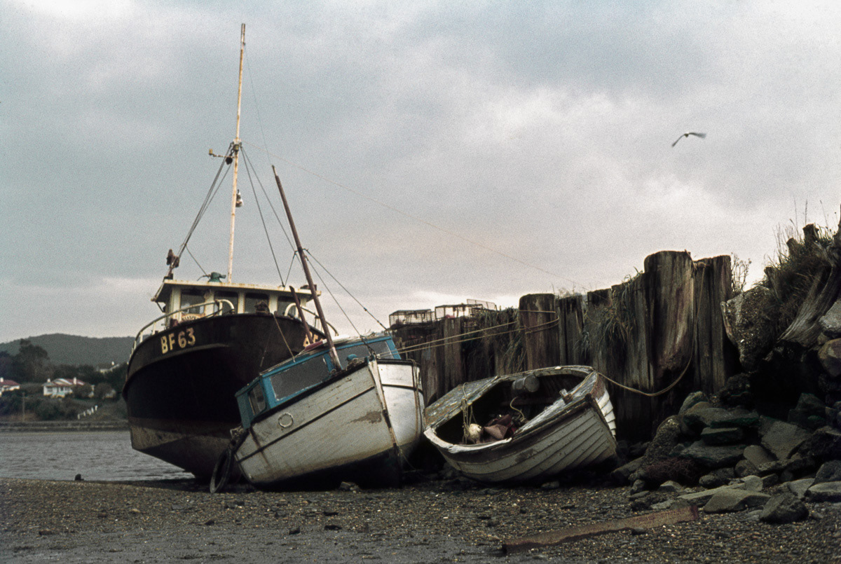 Boats beside the estuary at low tide, Riverton, Southland