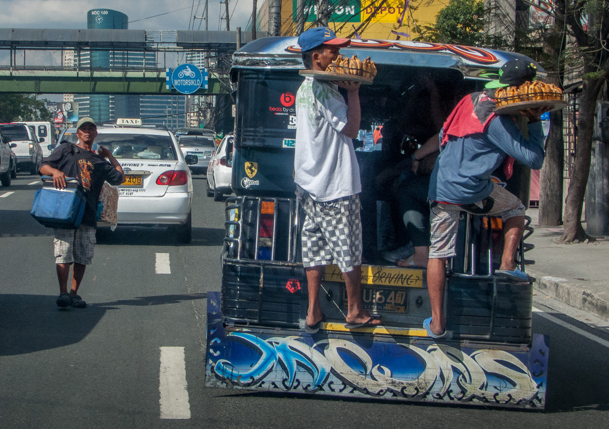 Food sellers on rear of jeepney, Taguig City, Metro Manila, Philippines, 2013