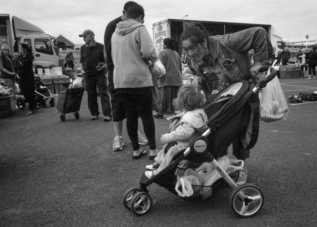 Mother with child in pram at Riverbank market, Lower Hutt, 2016