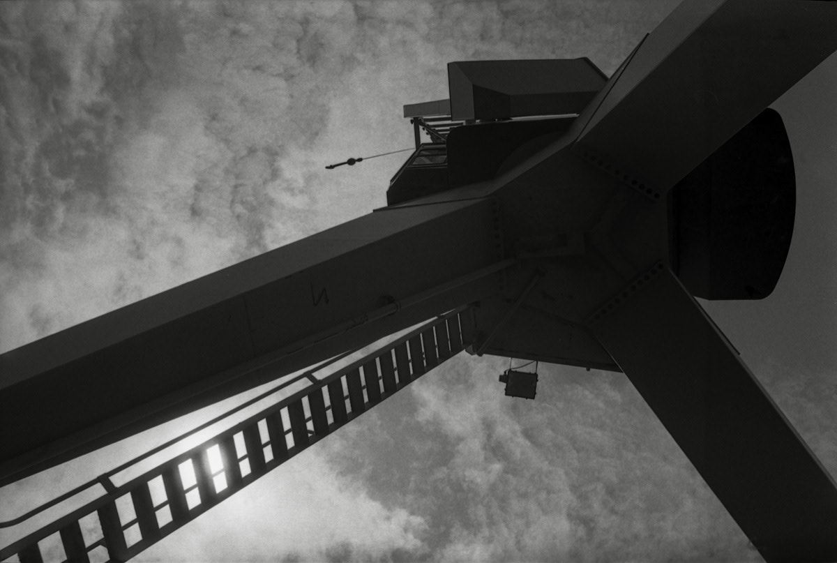 Looking up from below one of the old cranes on Wellington wharves, 1982