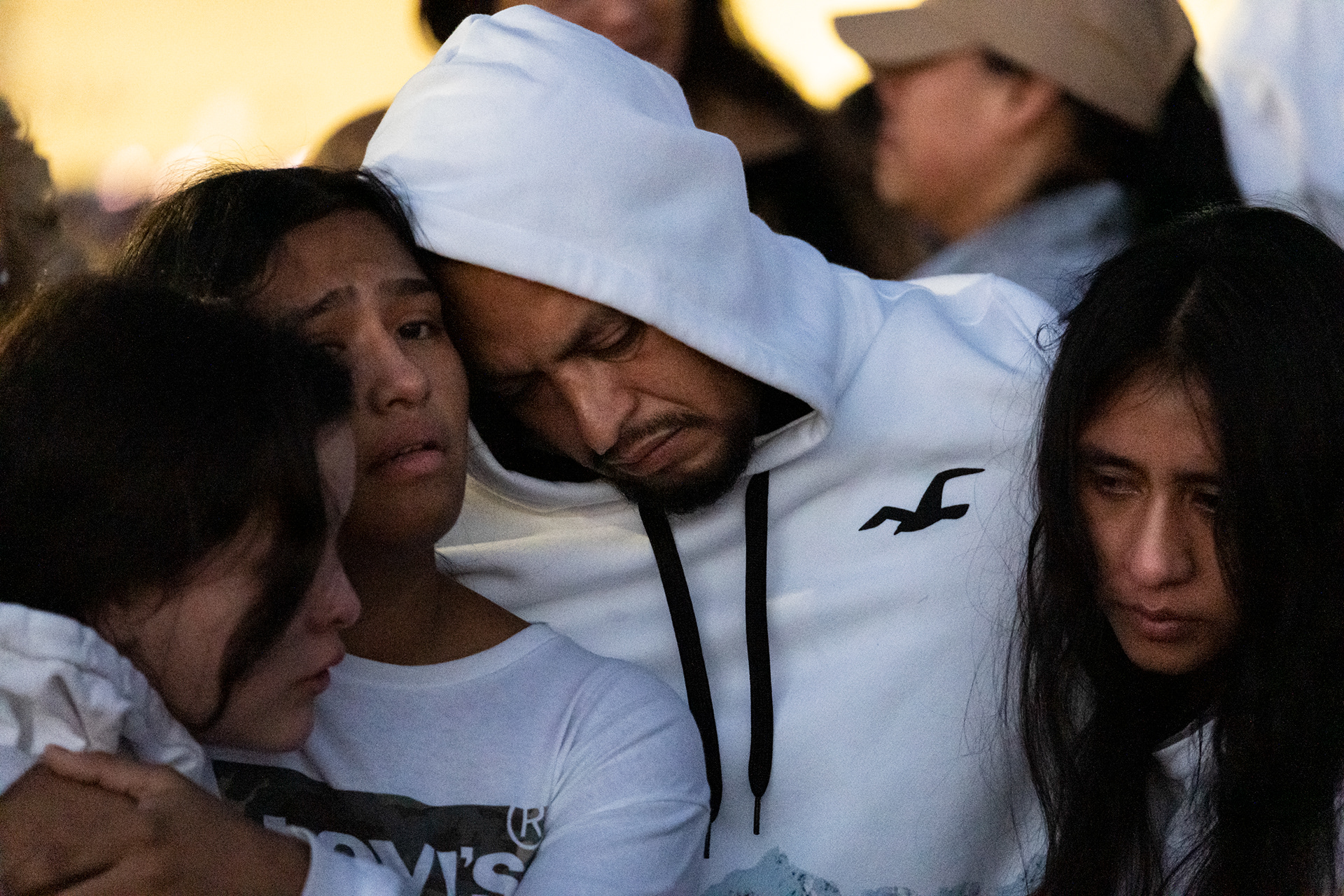 Fernando Chavez Sr. — father of 16-year-old Fernando Chavez-Barron, who was killed in the mass shooting Nov. 22, 2022 at a Chesapeake Walmart — is consoled by friends and family at a vigil for his son Nov. 24 in the store parking lot. Five other people, and the gunman, died; four more suffered gunshot wounds.
