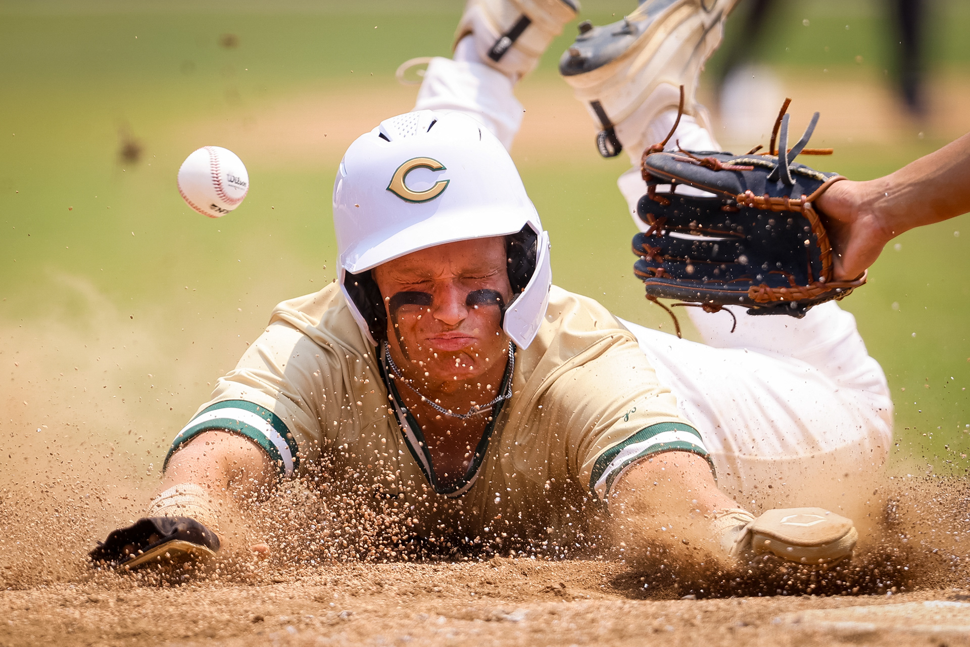 Cox baserunner Conner Worth (14) slides safe into home plateto take a 2-1 lead over Great Bridge in the Class 5 Region A semifinal at Cox High School in Virginia Beach, Virginia, on May 31, 2025.