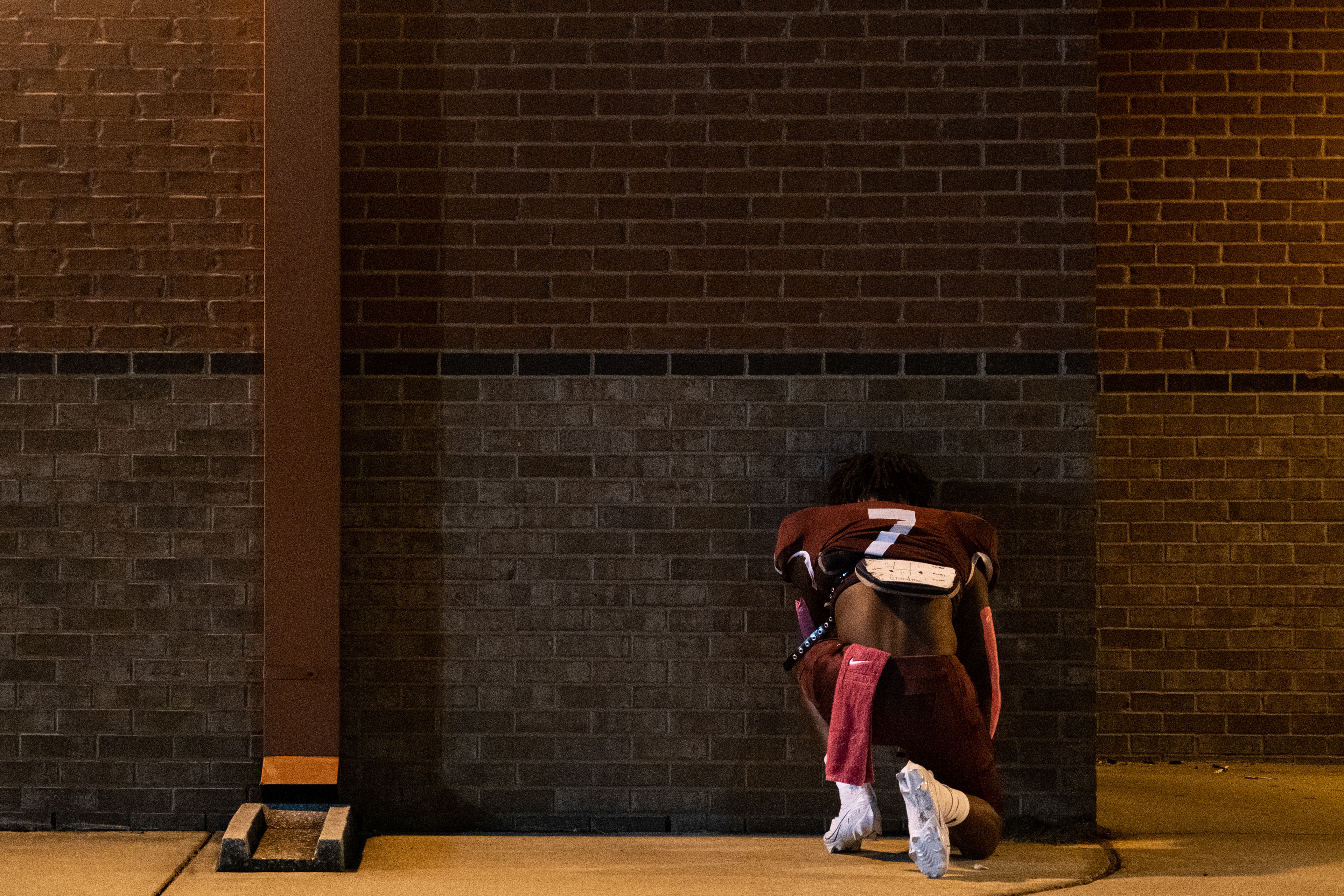 Jarnorris Hopson from Horn Lake High School prays before the start of the game against Hernando High School. Horn Lake defeated Hernando 16-14 in Hernando, Mississippi on Oct. 16, 2020.