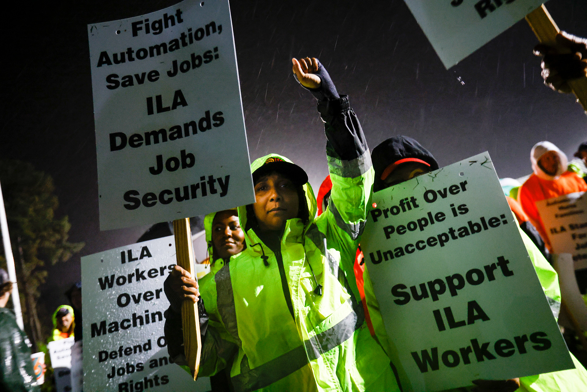Longshoremen Meikysha Wright protests outside of the Virginia International Gateway in Portsmouth, Virginia, in the early hours of Oct. 1, 2024. Wright has worked at the location for seven years. “It means job security,” Wright said. “We want to keep blue collar jobs for generations.”
