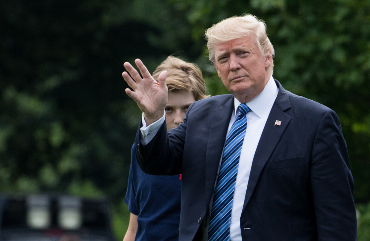 President Donald Trump, and his 11-year-old son Barron, walk across the South Lawn of the White House to board Marine One, on Friday, June 30, 2017. The First Family was headed to Trump National Golf Club, in Bedminster, NJ, for the Fourth of July weekend. (Photo by Cheriss May)