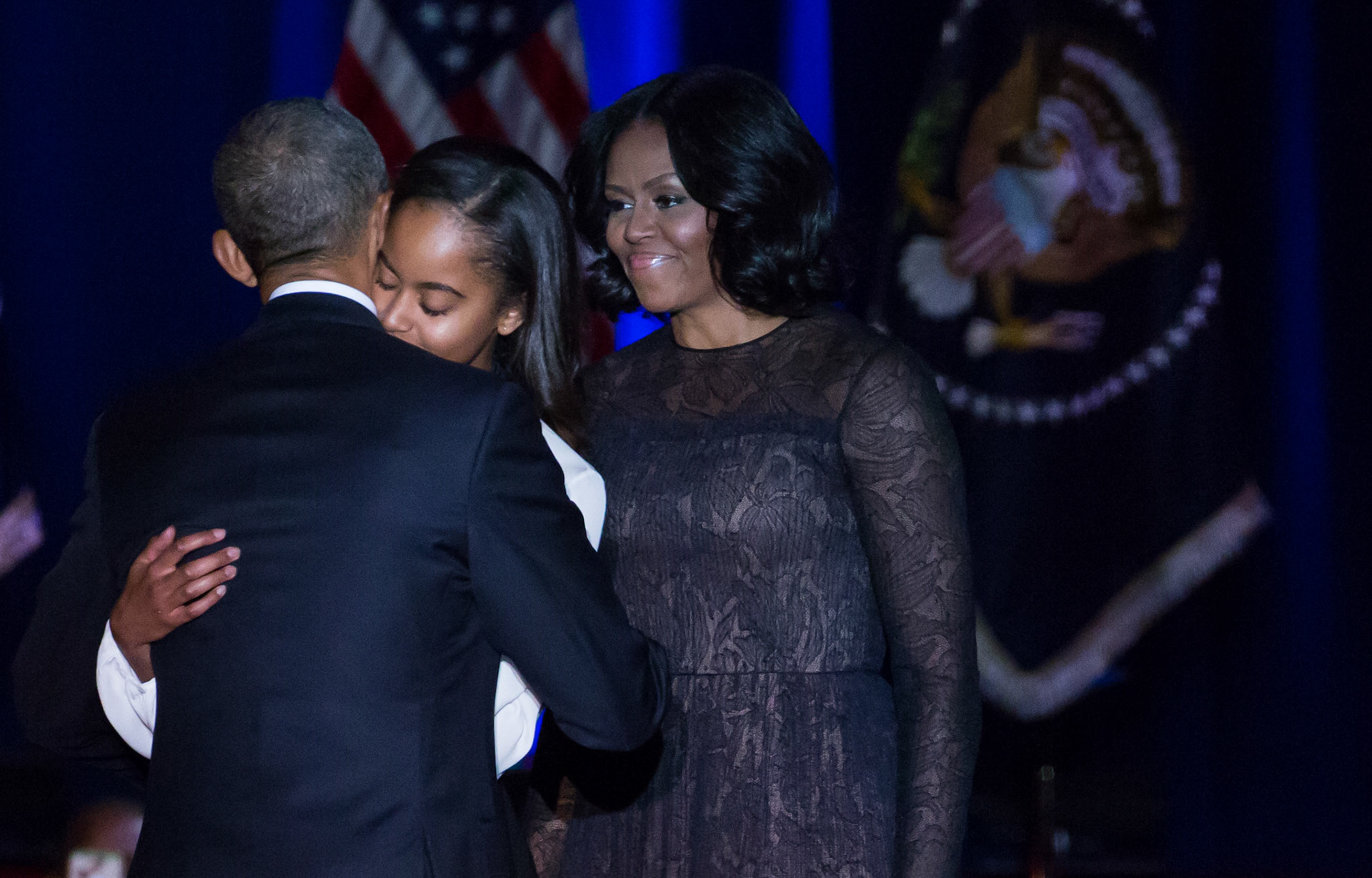 CHICAGO, IL  - On Tuesday, January 10, U.S. President Barack Obama hugs his daughter, Malia, as he welcomed her and his wife, First Lady Michelle Obama, to the stage, after delivering his farewell address to the American people at McCormick Place in Chicago, Illinois. | ©2016 Photo by Cheriss May, www.cherissmay.com