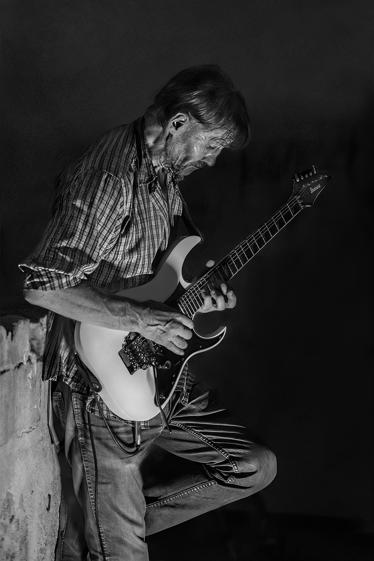 The late Elon - he used to play exquisite jazz and rock guitar uitar music in Valletta