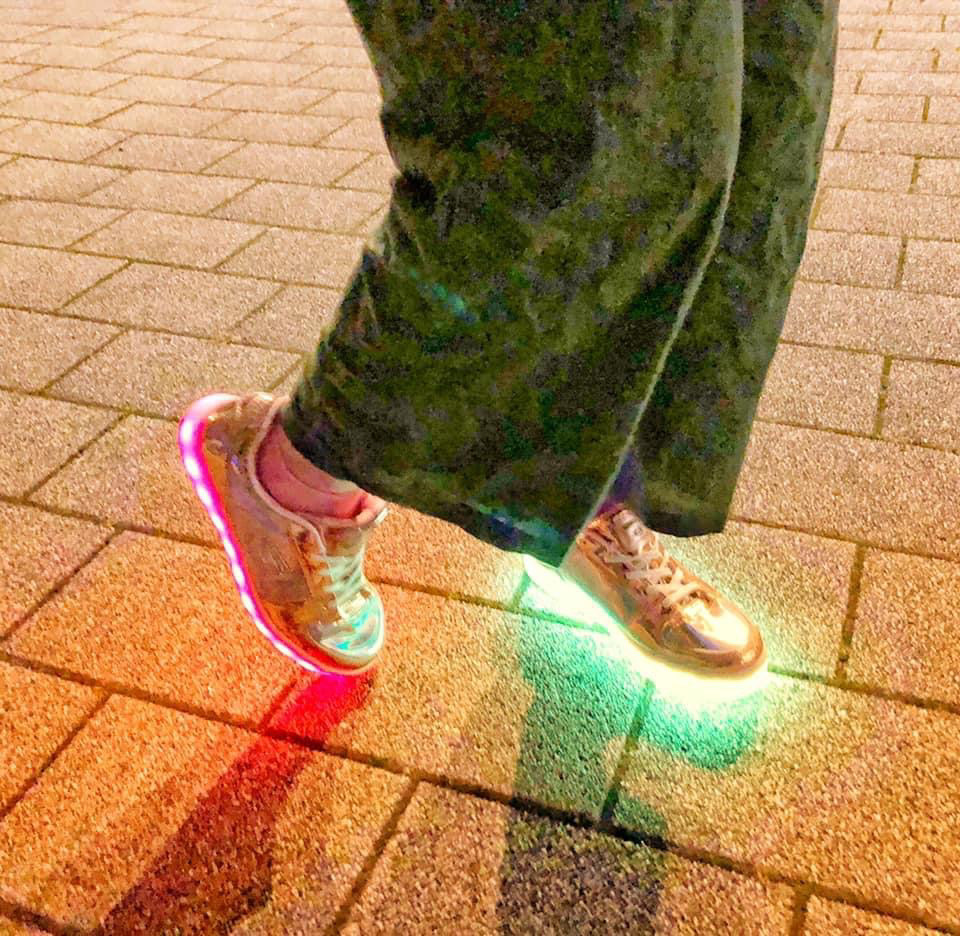 Lady dancing with light up shoes