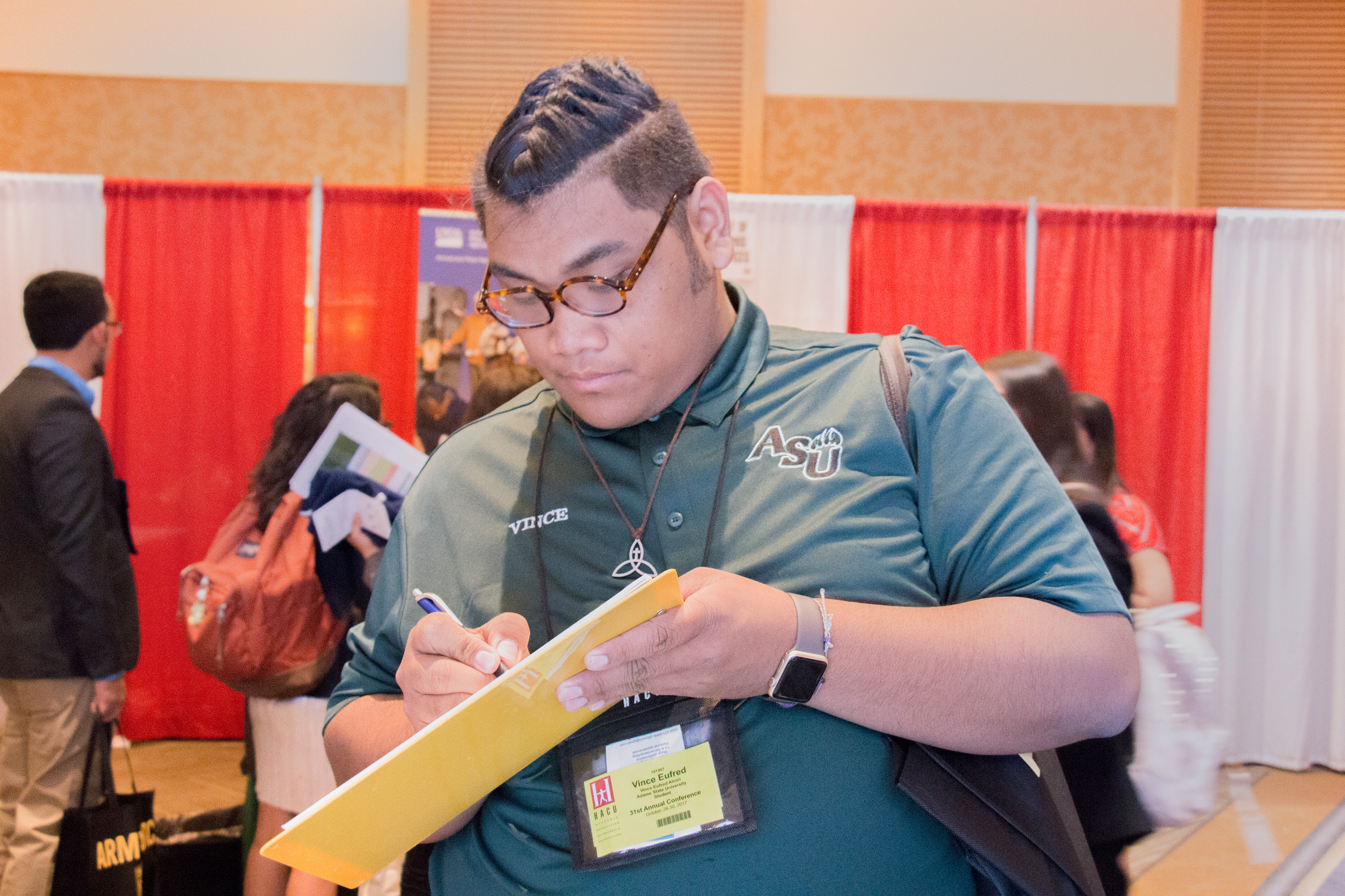 Student signs up for GHFP-II mailing list at the Hispanic Association of Colleges and Universities Annual Conference.