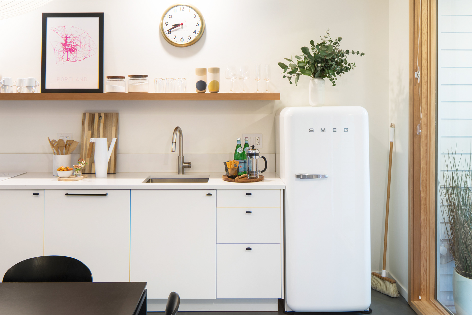 A minimal and functional kitchen features everything needed to prepare a meal.