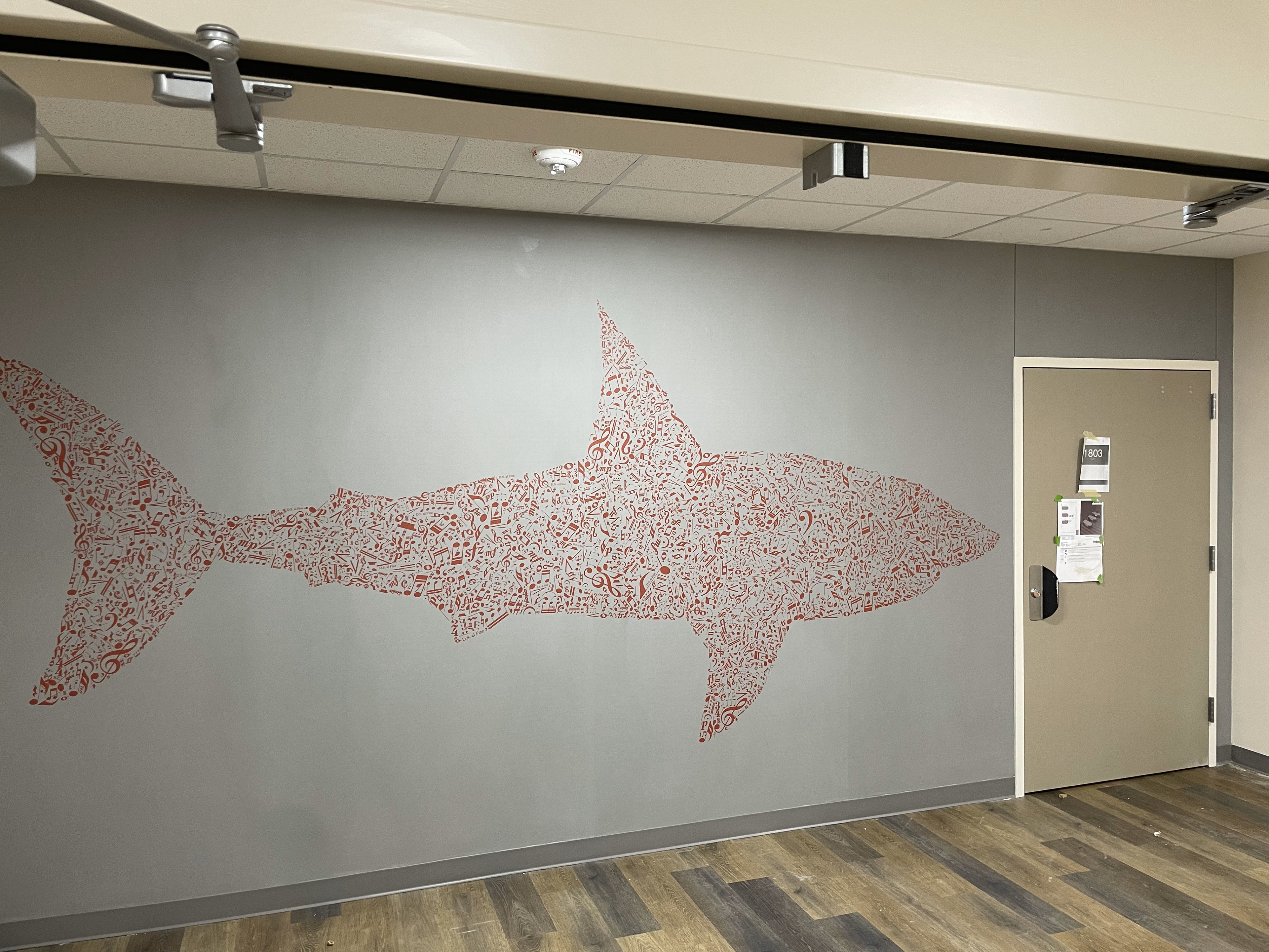 Shark outline/silhouette made out of music symbols