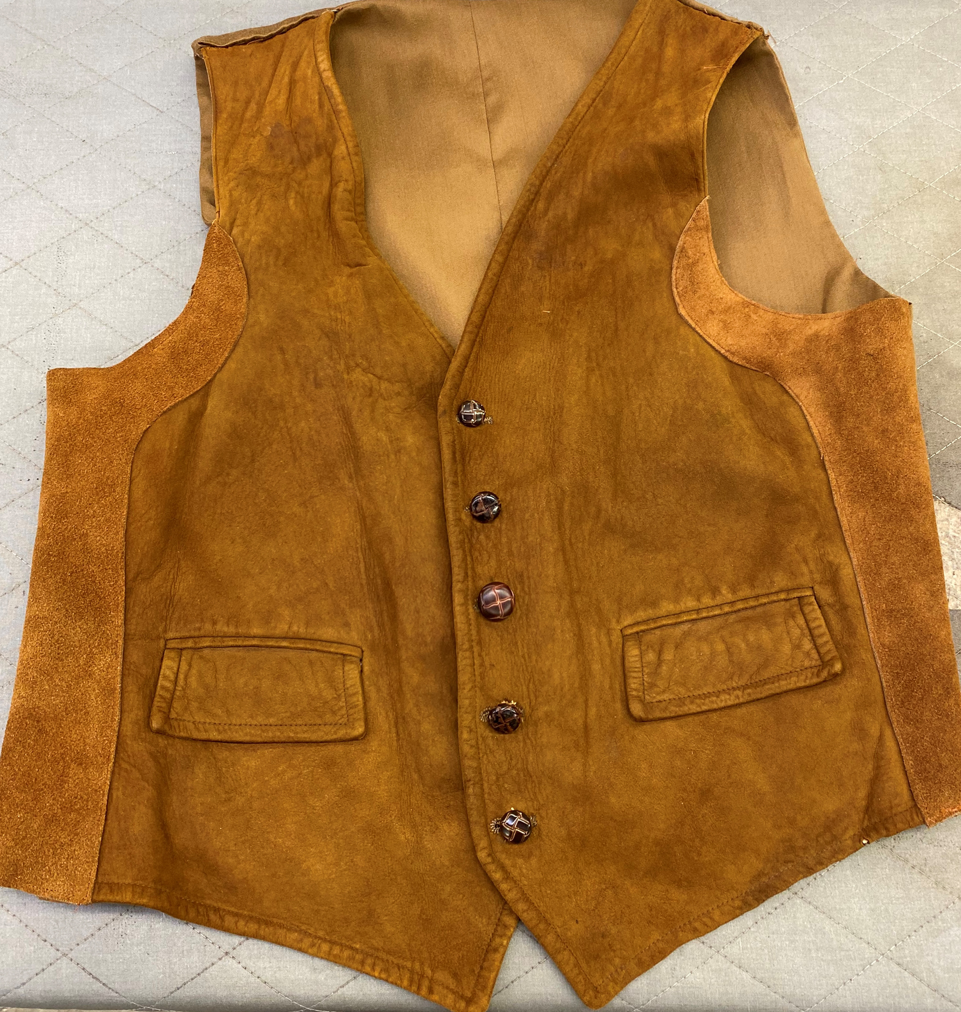 Covered and repaired dry rot by adding suede patch over the side seams 