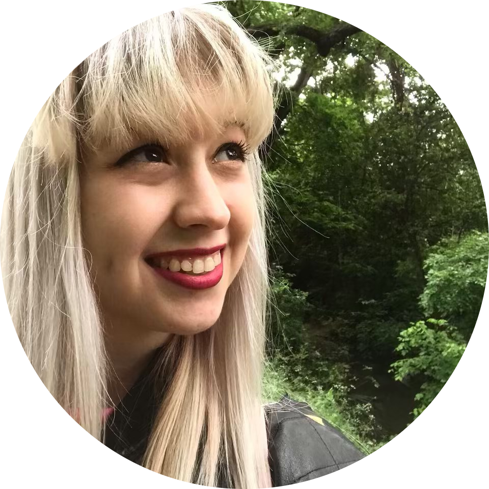 Foreground features Bailey Vaughan, young woman with bangs and long blonde hair. Background features dense trees.